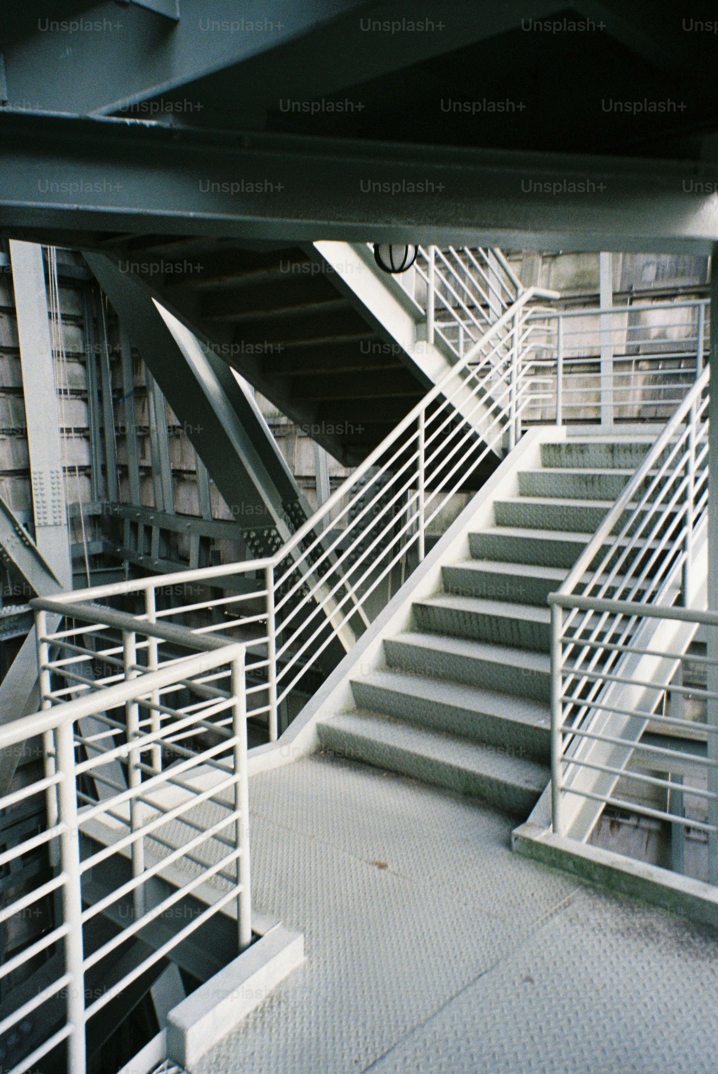 Industrial staircase with metal railings and platforms. photo ...