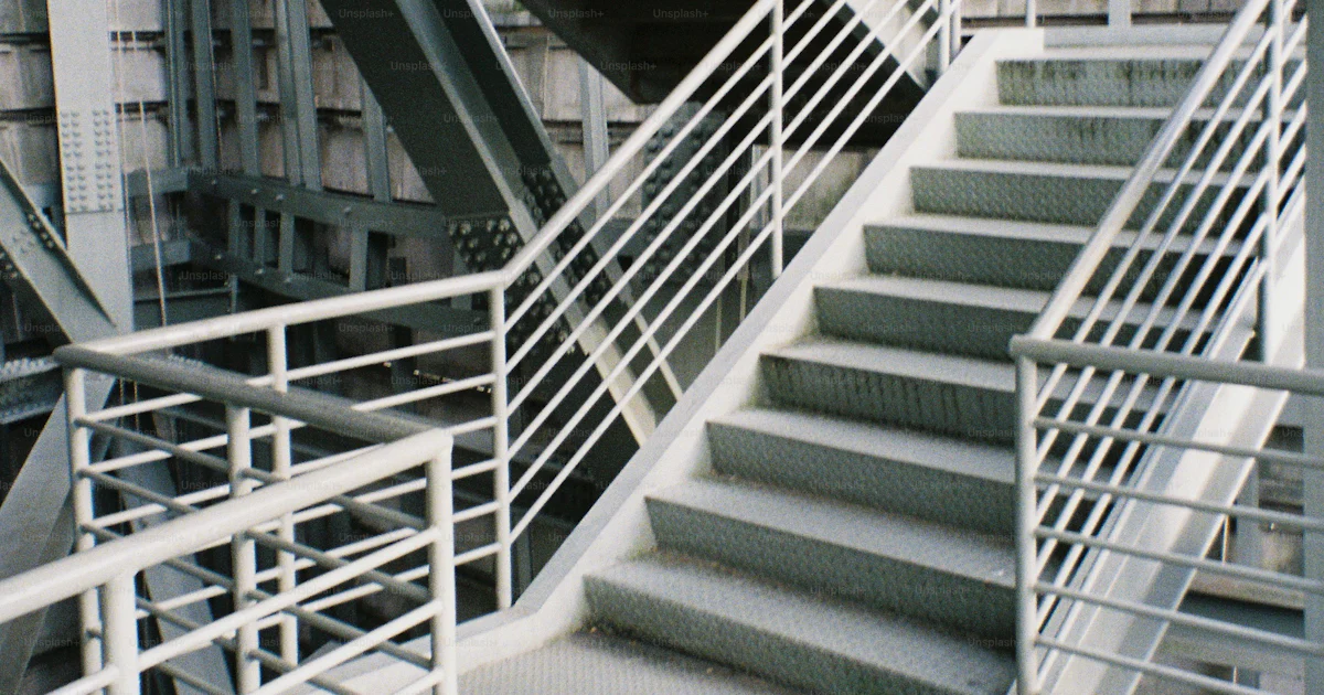 Industrial staircase with metal railings and platforms. photo ...