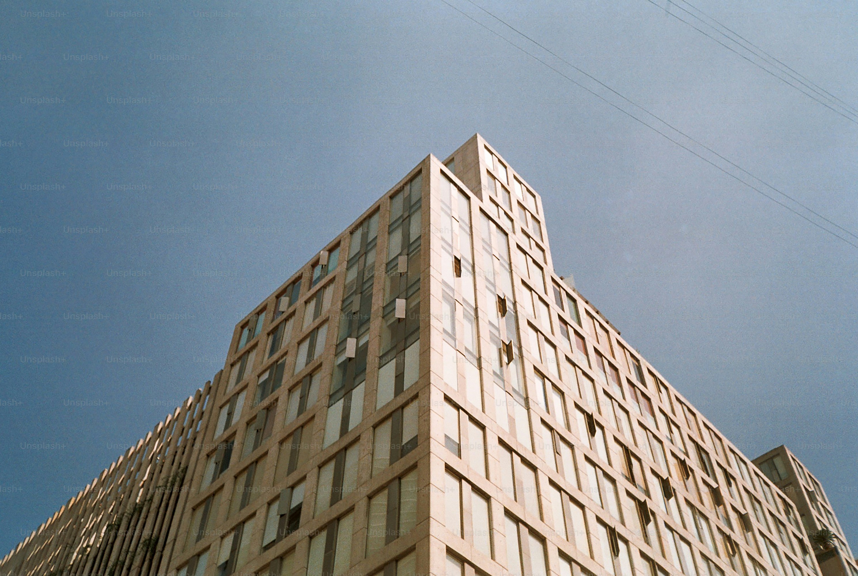 Modern building facade against a clear blue sky
