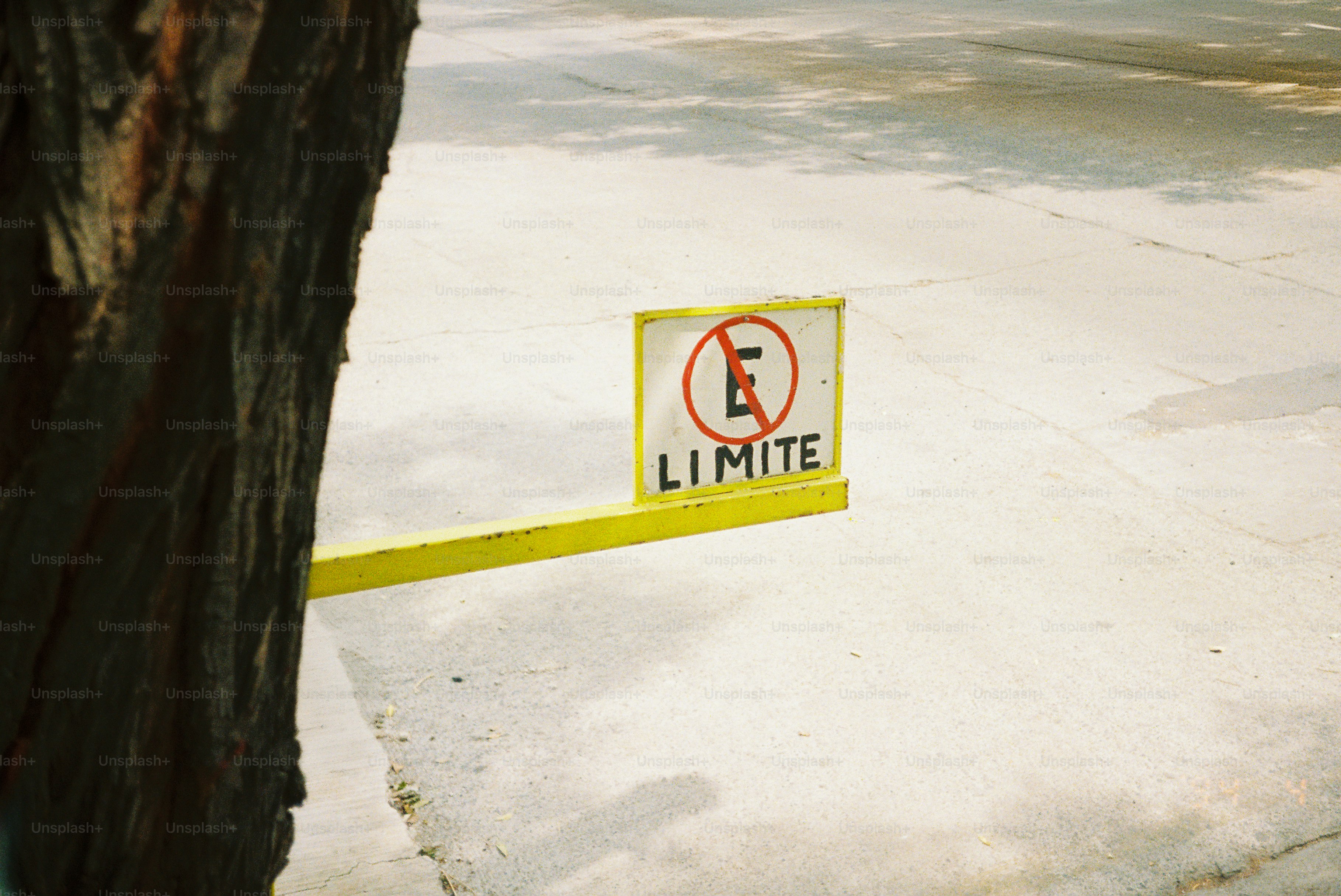 No parking sign with yellow barrier and white colors