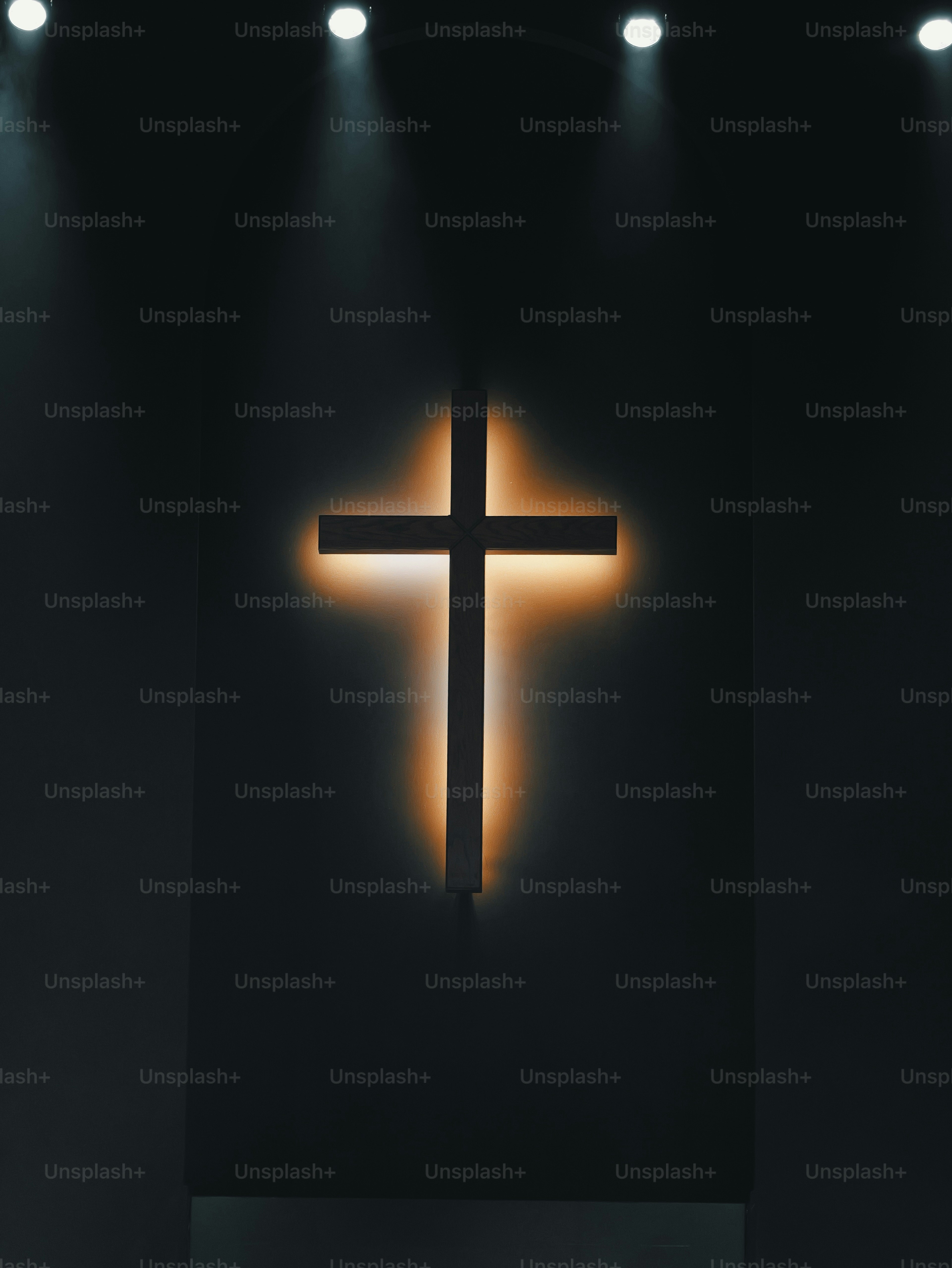 A glowing cross on a dark background