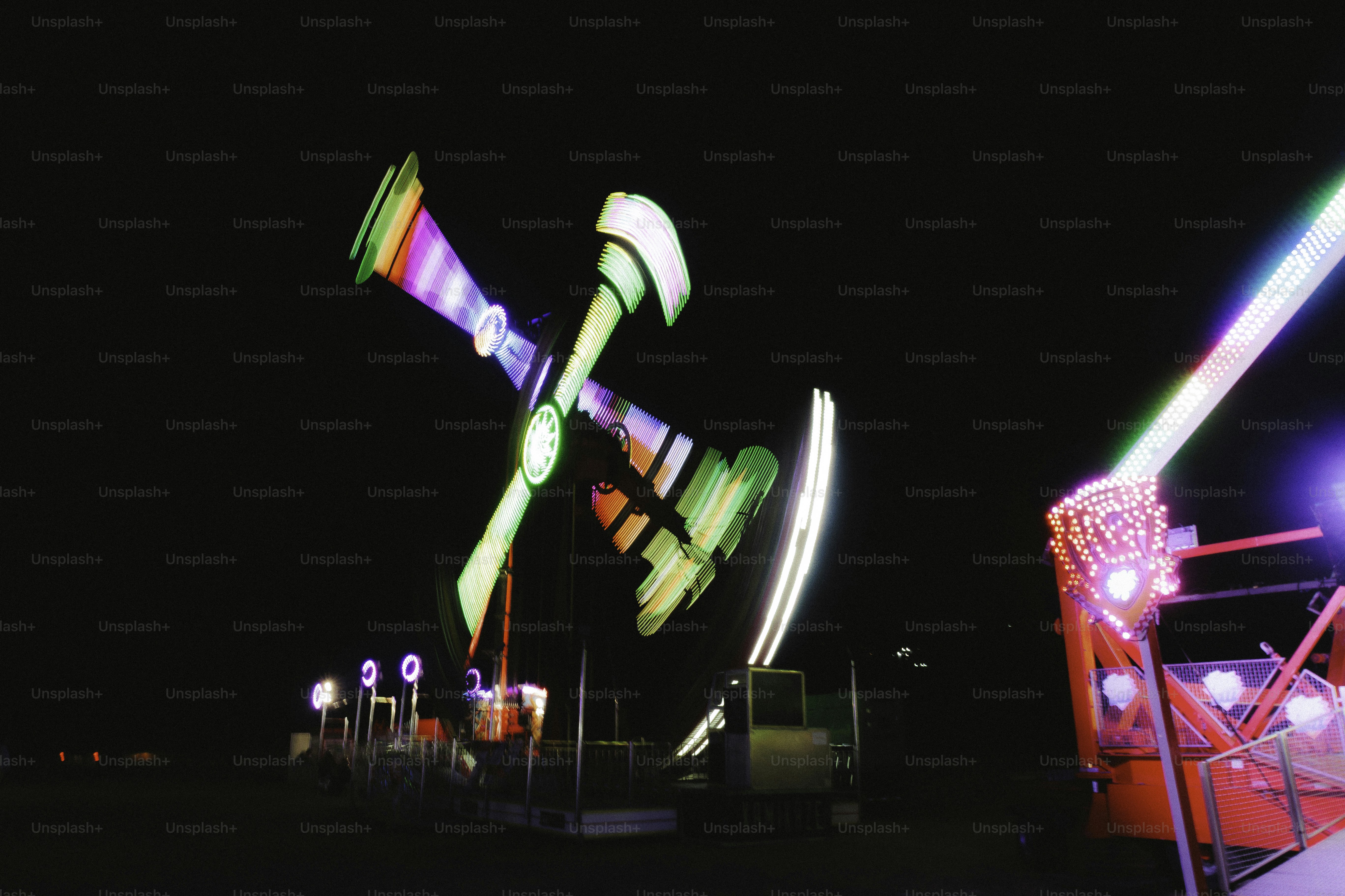 Carnival ride with colorful lights at night