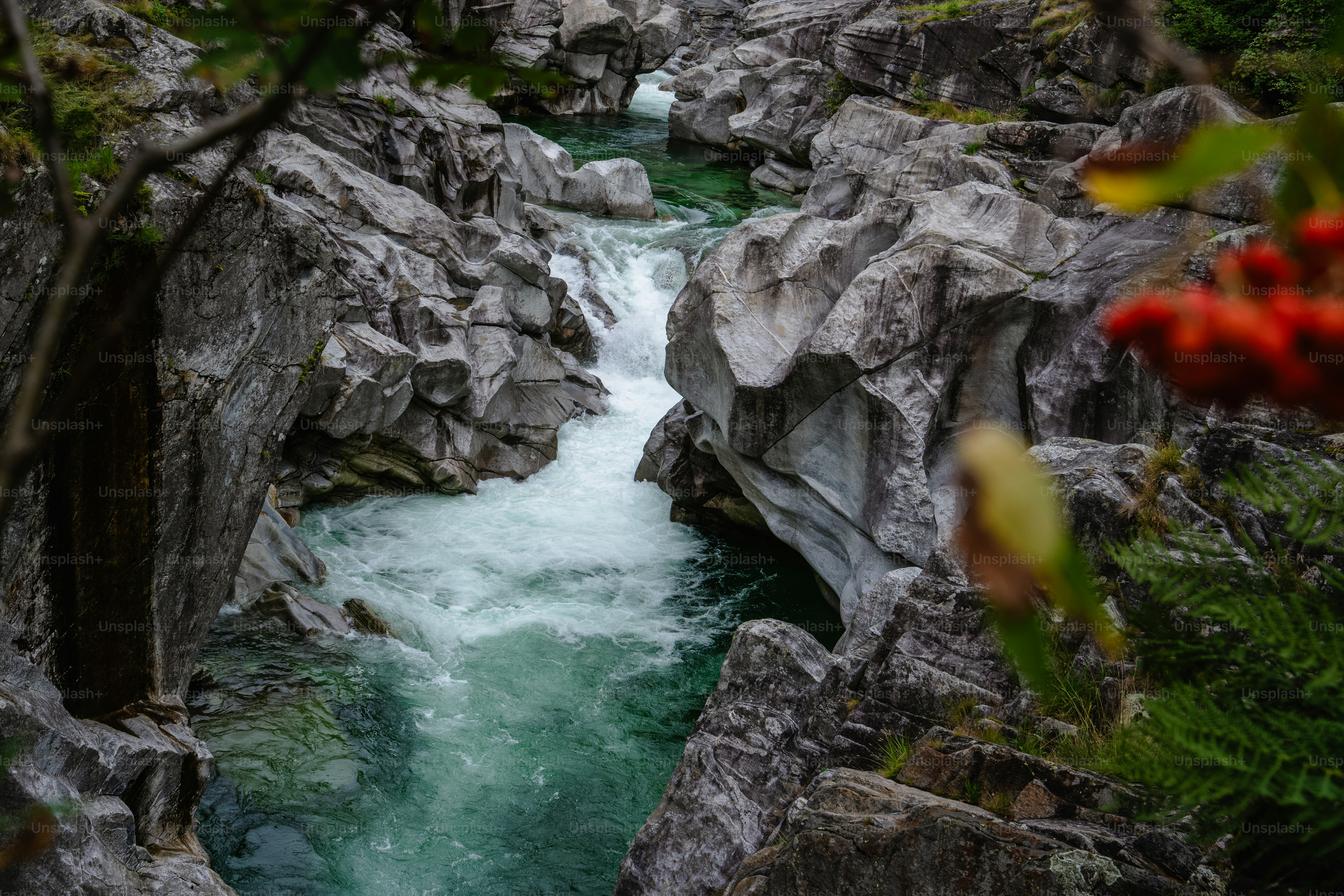 A clear river flows through rocky terrain