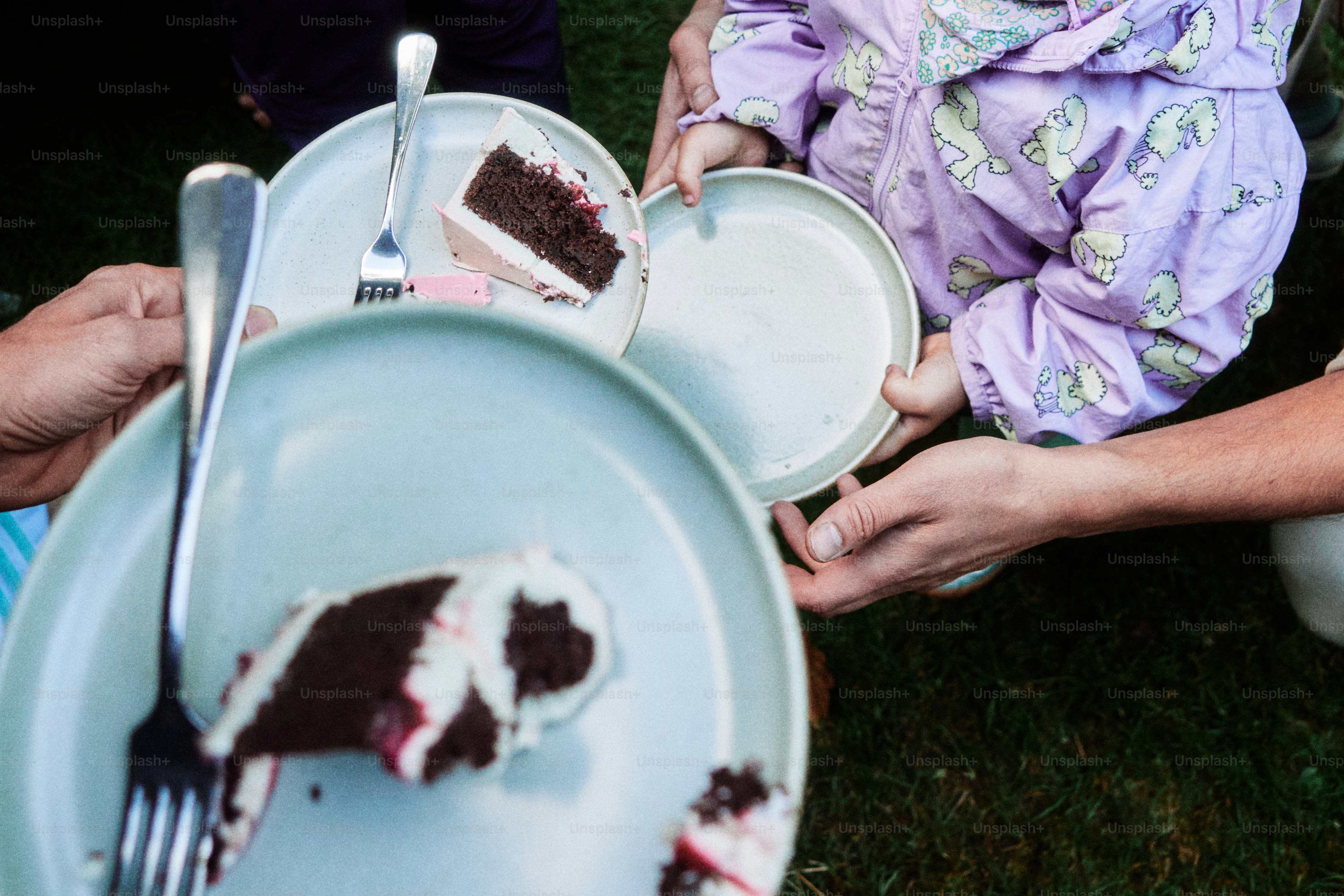 Dirty plates with leftover cake and forks