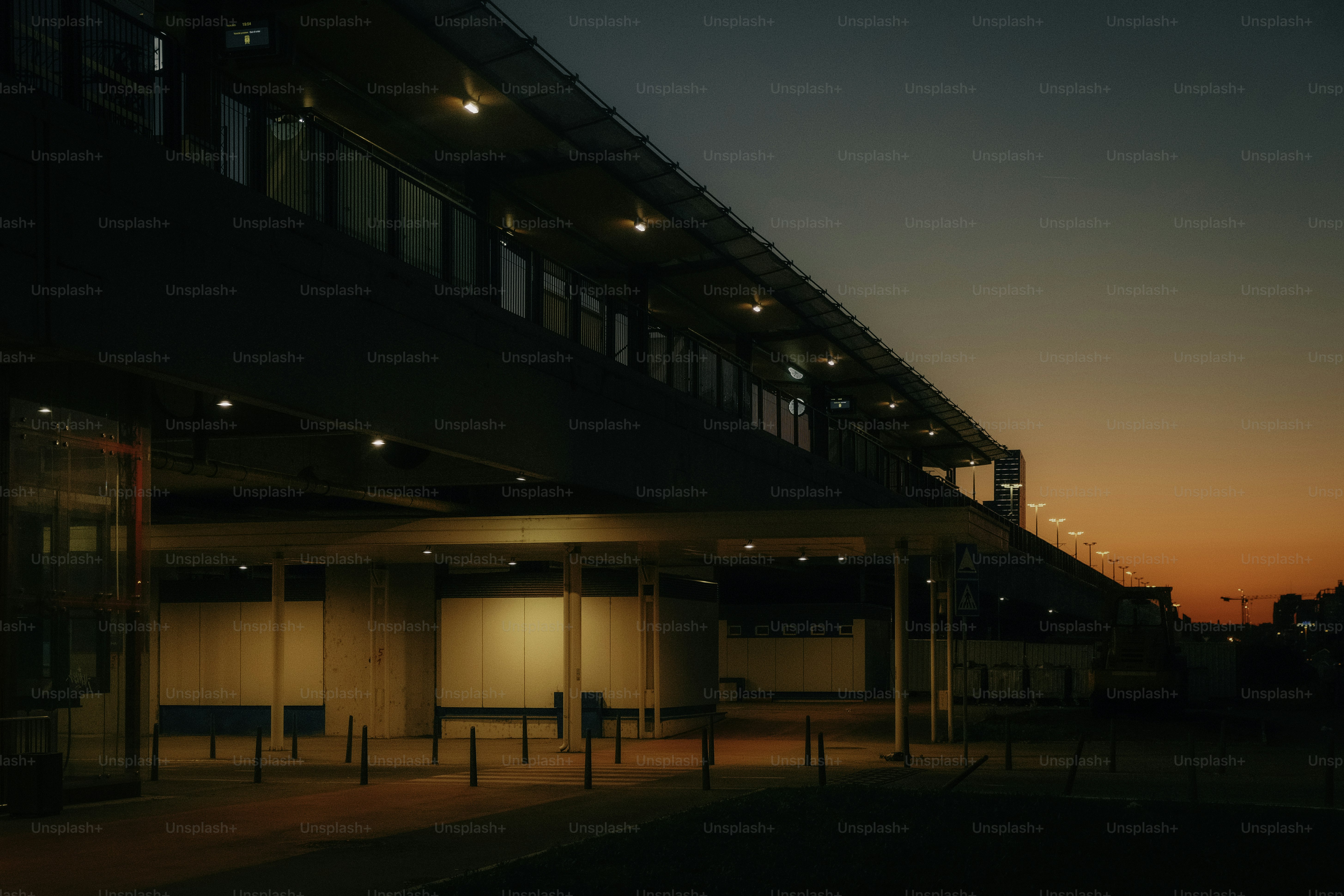 Modern building facade at dusk with colorful sky