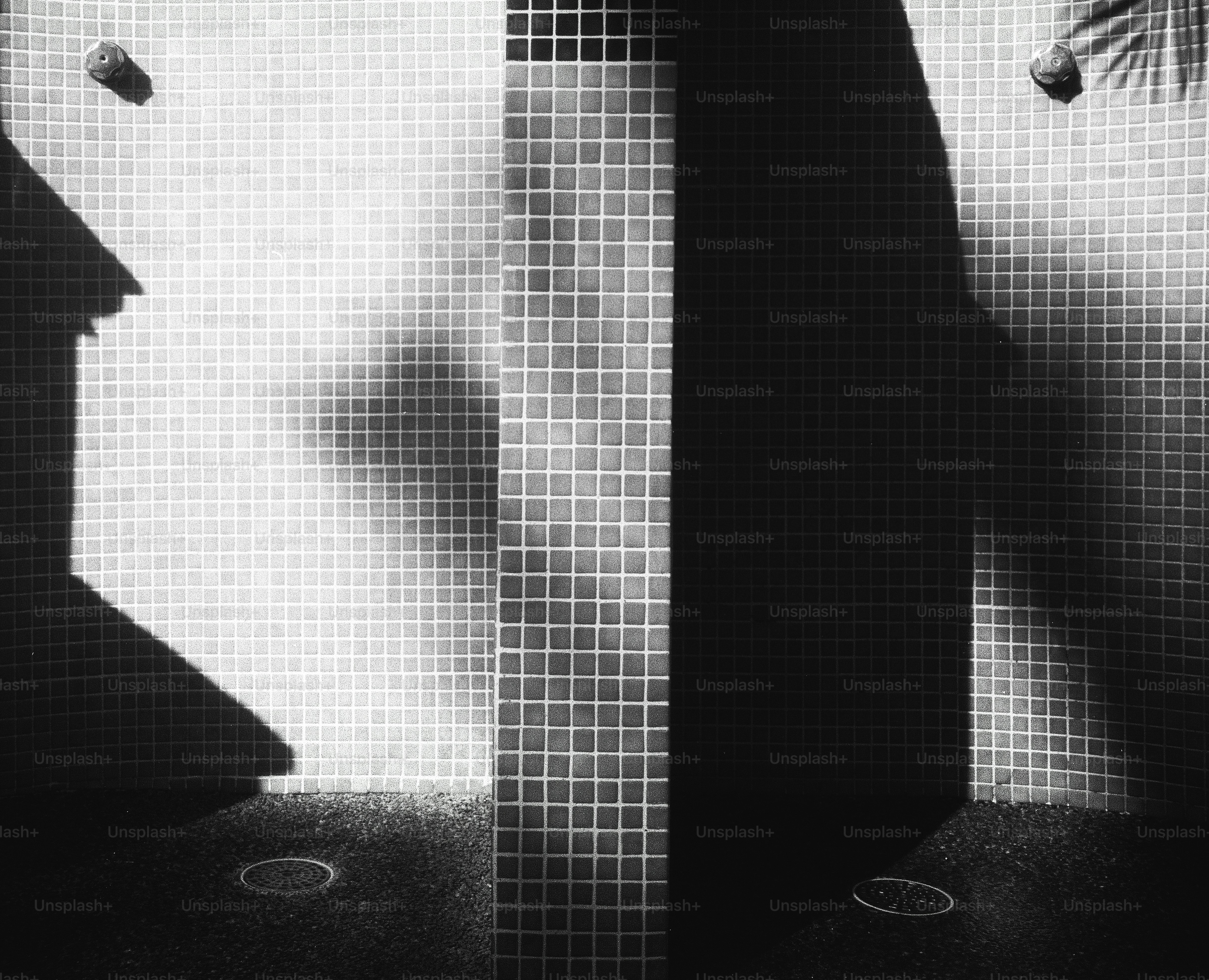 Tiled wall with dramatic shadows and light