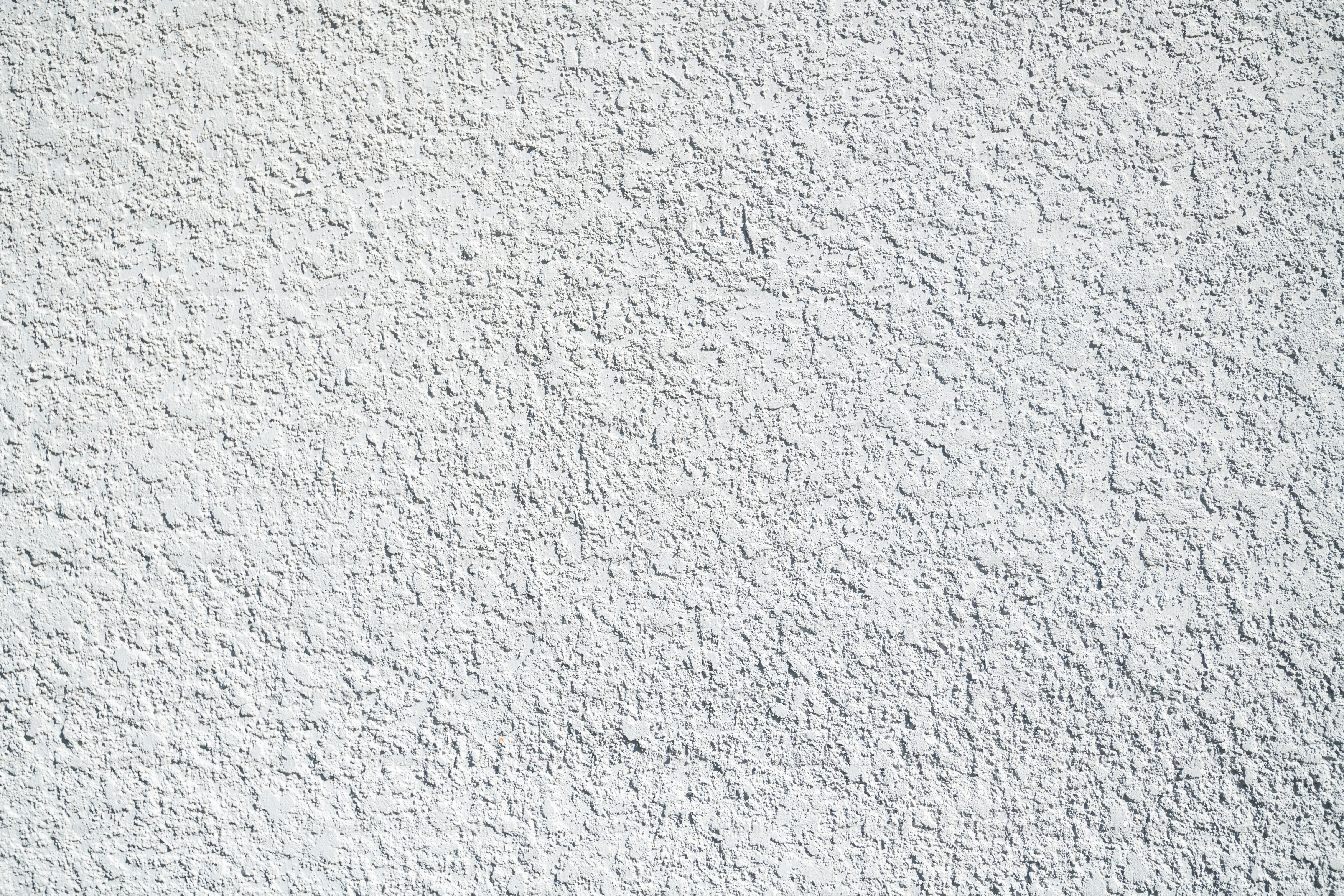 白い壁のクローズアップでテクスチャされた表面。