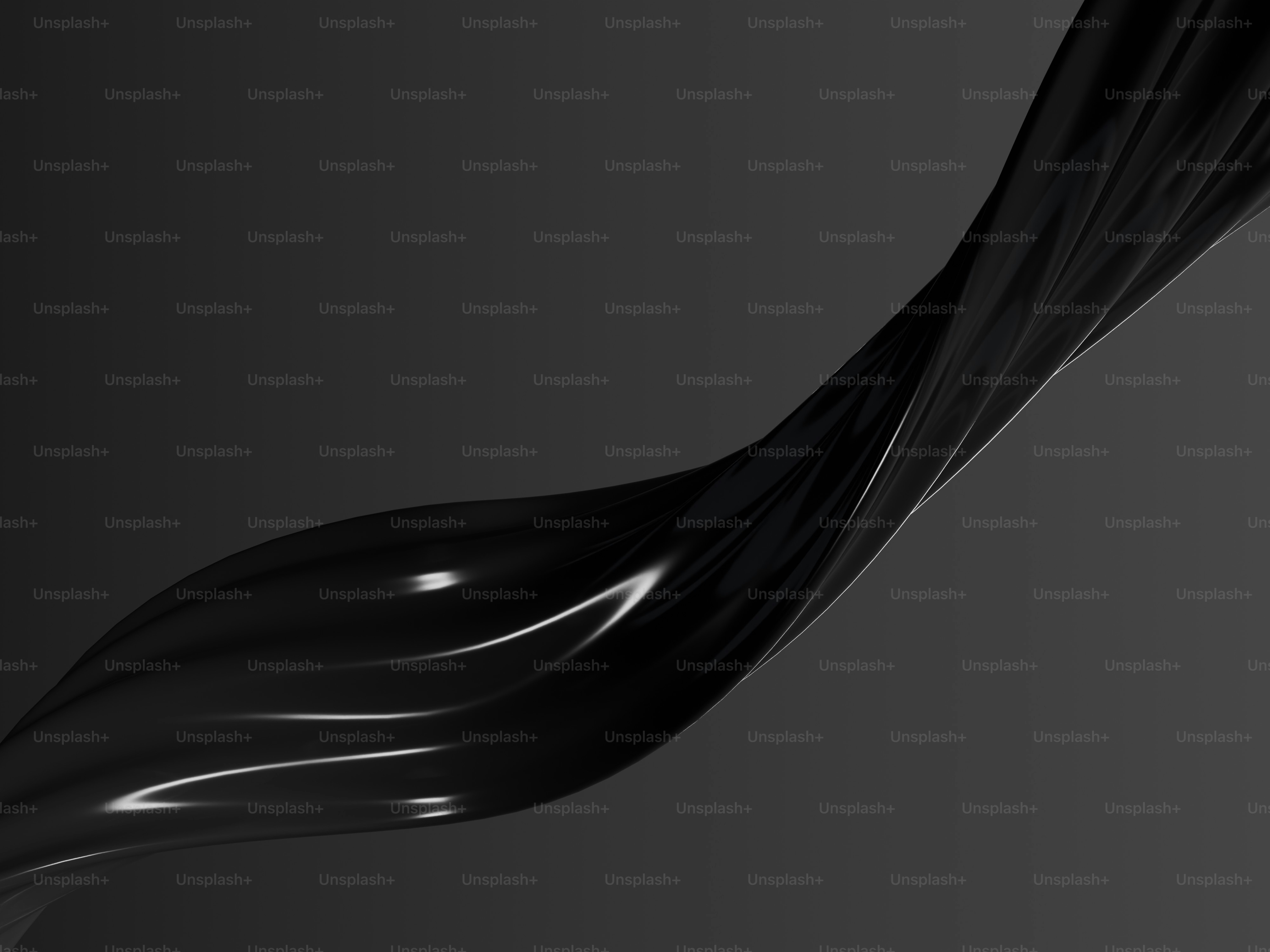 어두운 배경 위에 추상적인 검은 액체가 소용돌이치고 있다