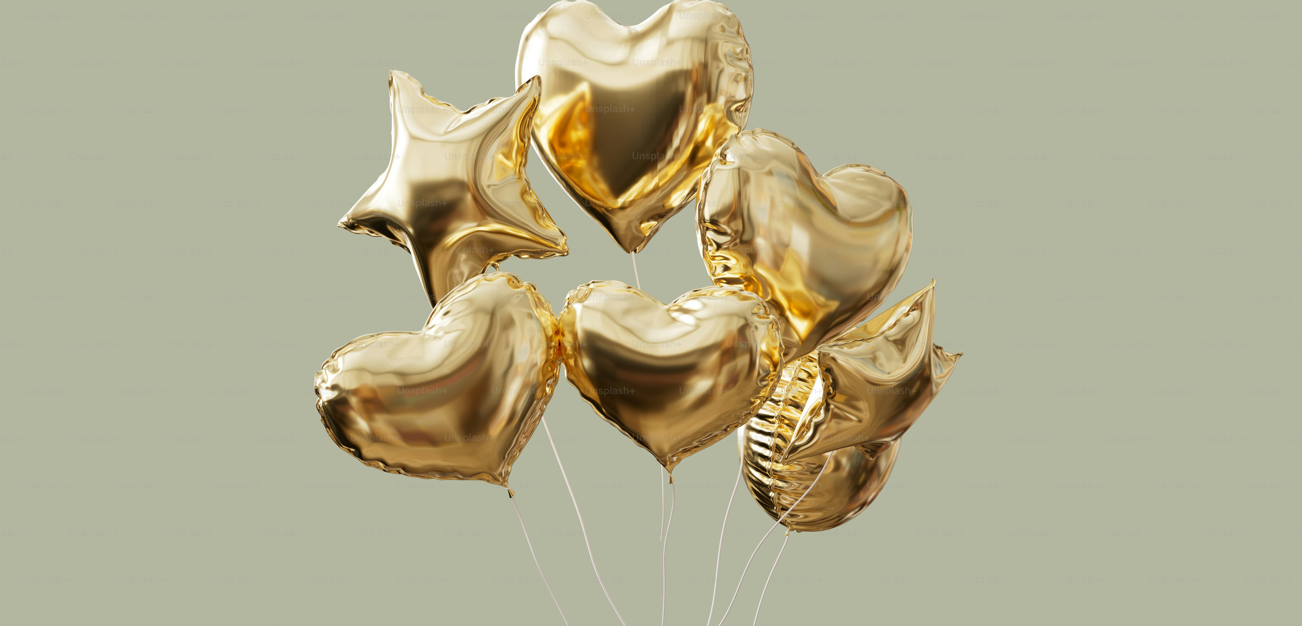 A cluster of golden heart and star balloons.
