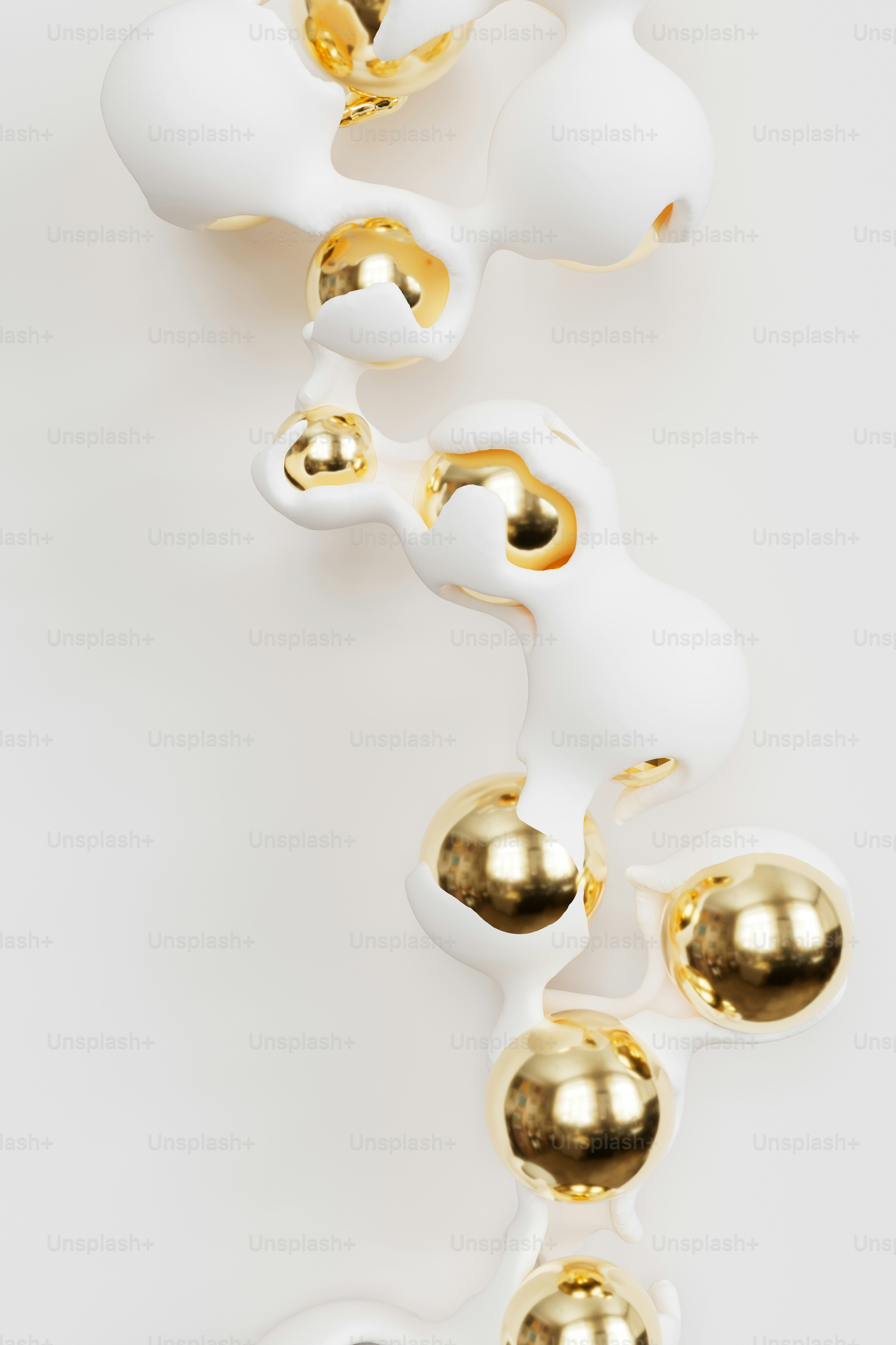 White organic shapes with gold spheres on white
