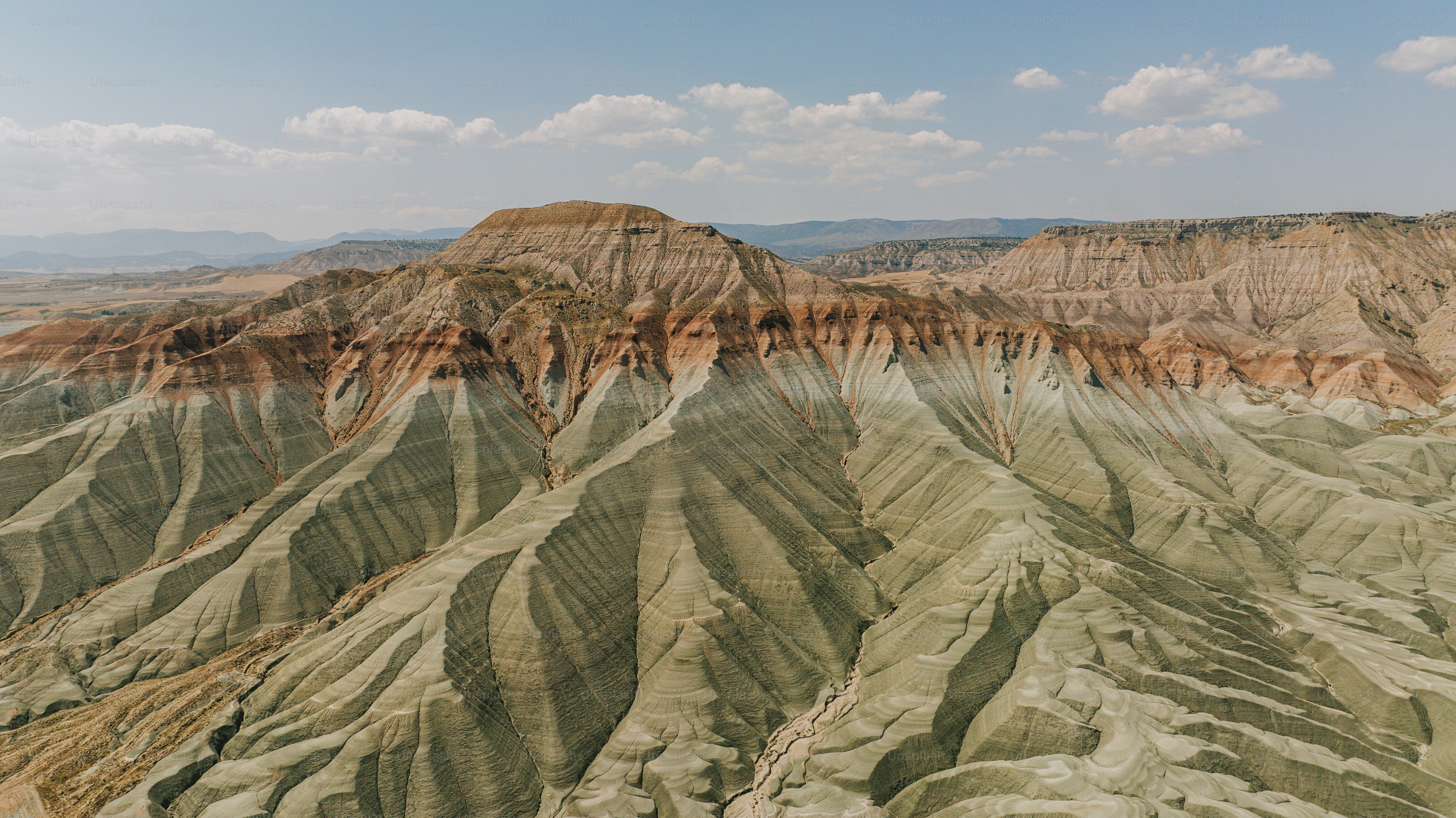 Layered hills with green and red earth