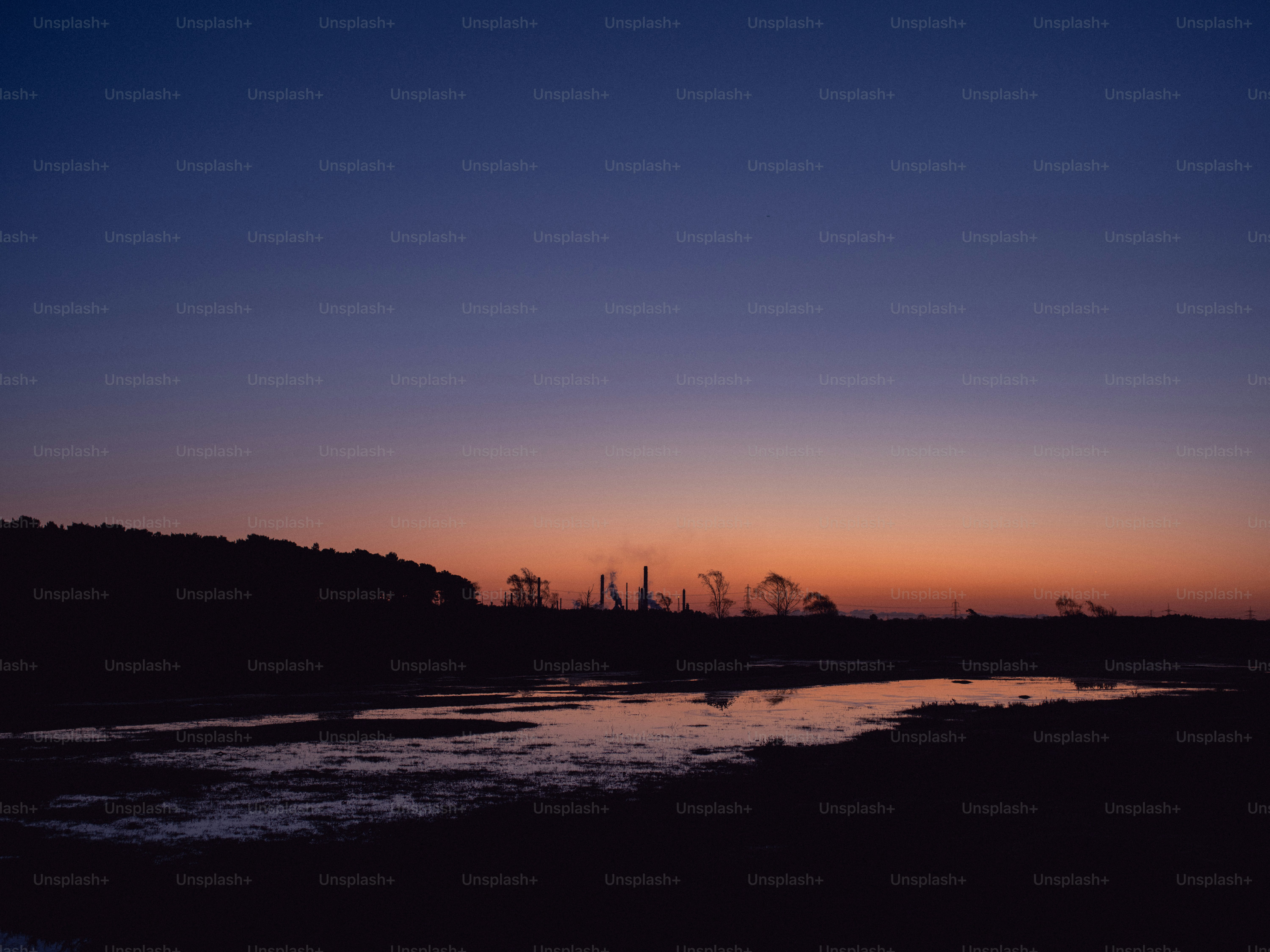 Sunset over a calm body of water