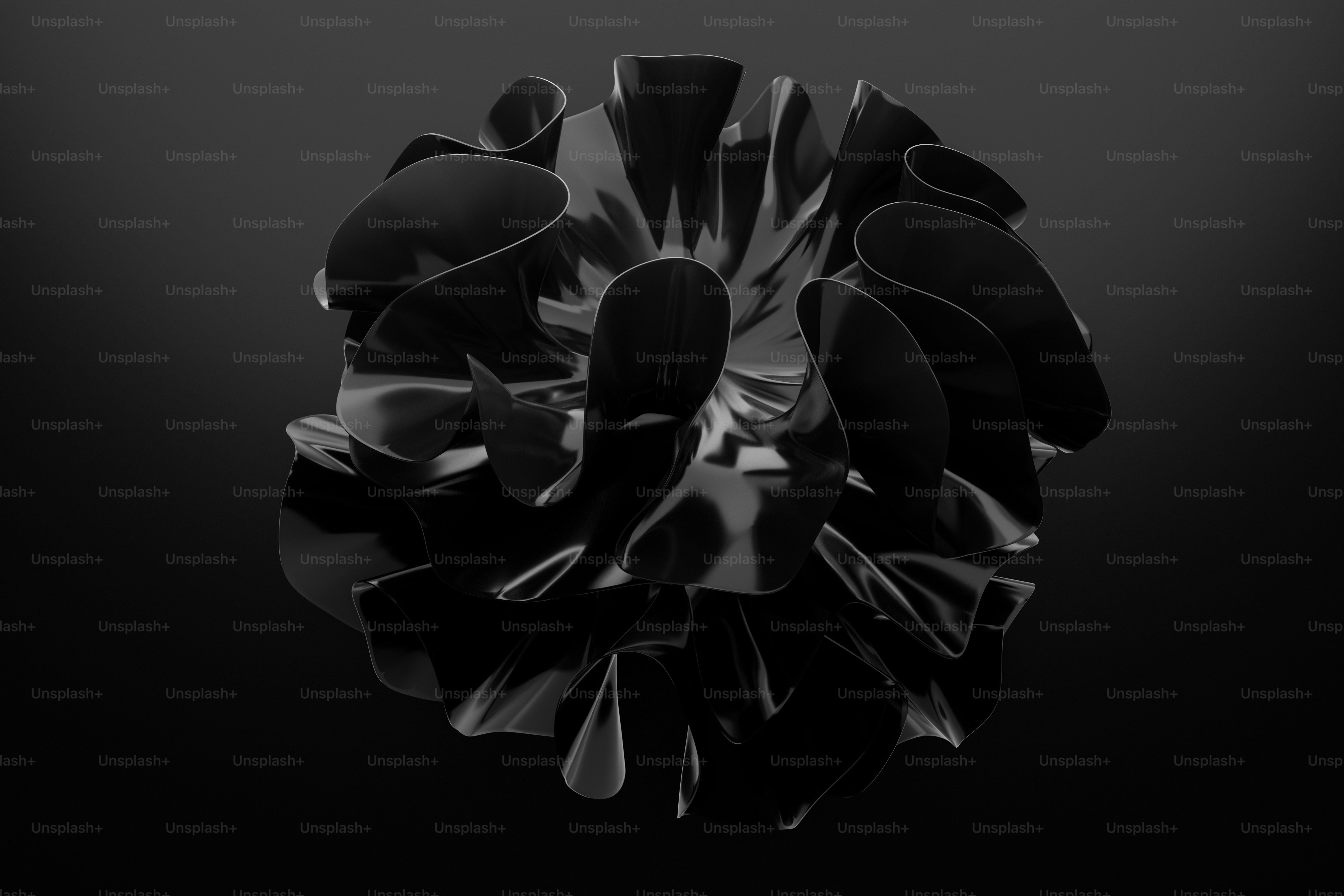 광택 있는 질감을 가진 추상적인 검은색 비정형 형태