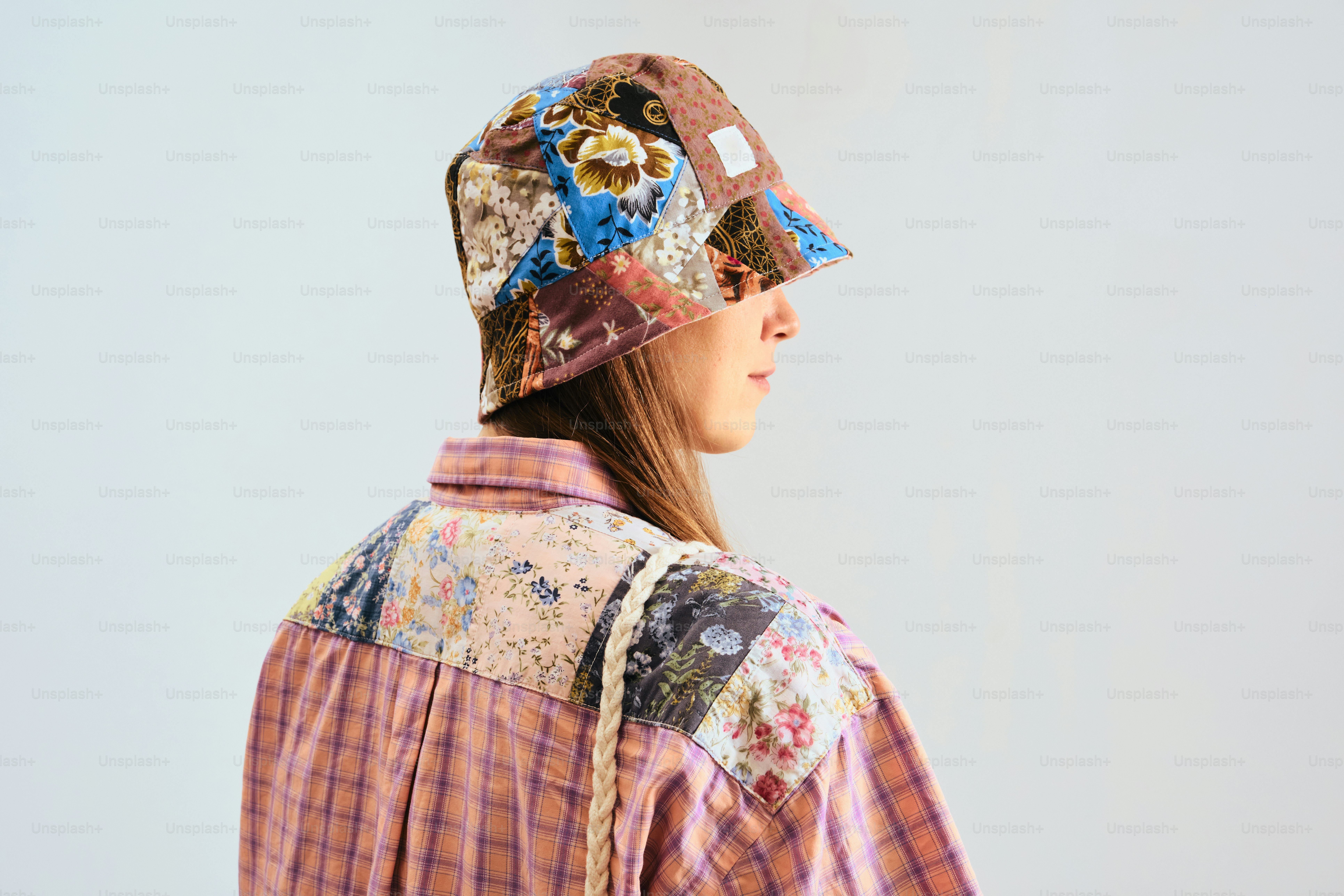 Woman wearing a patchwork bucket hat and shirt