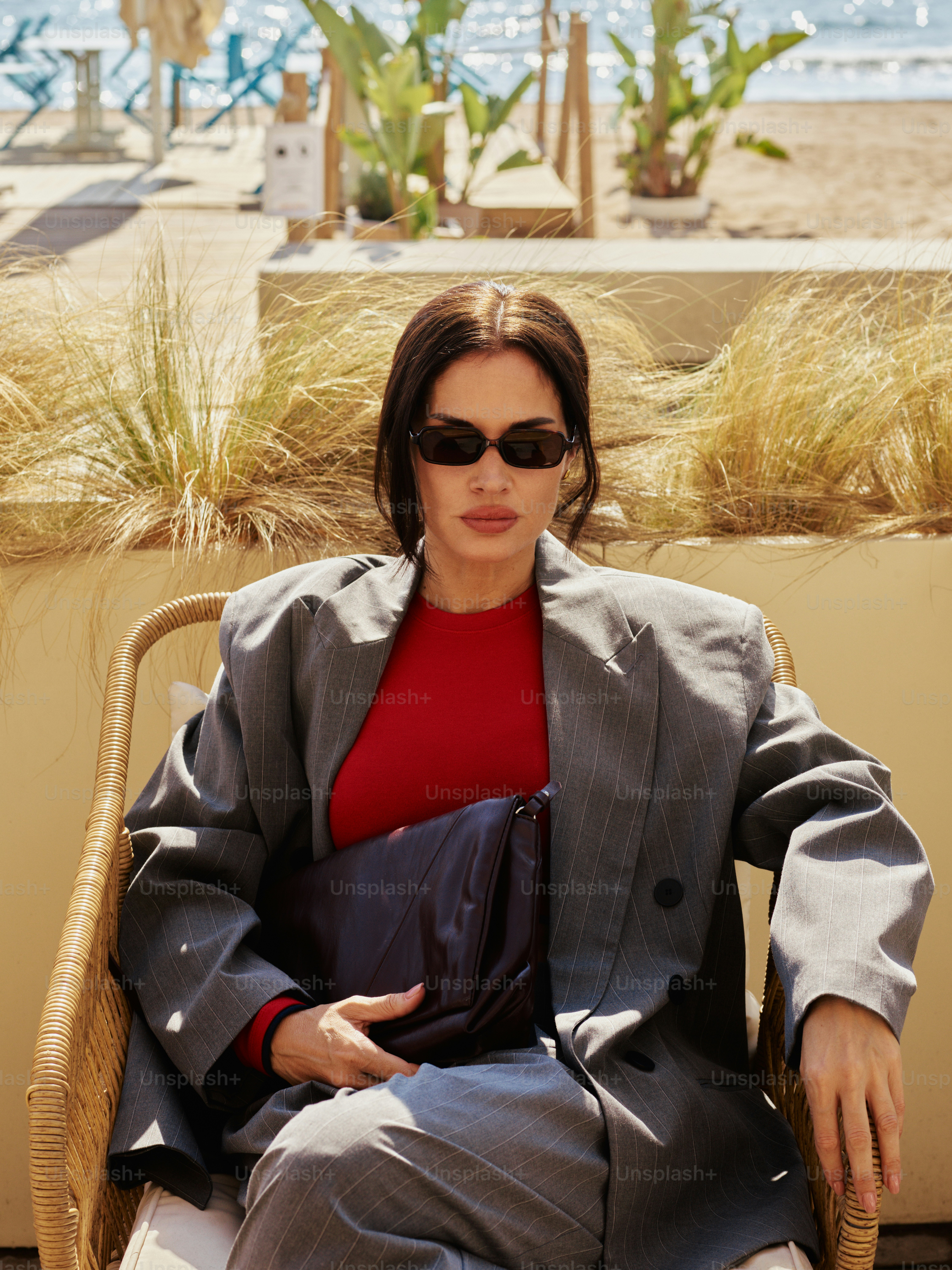 Woman in a gray pinstripe suit and red shirt photo – Woman Image on ...