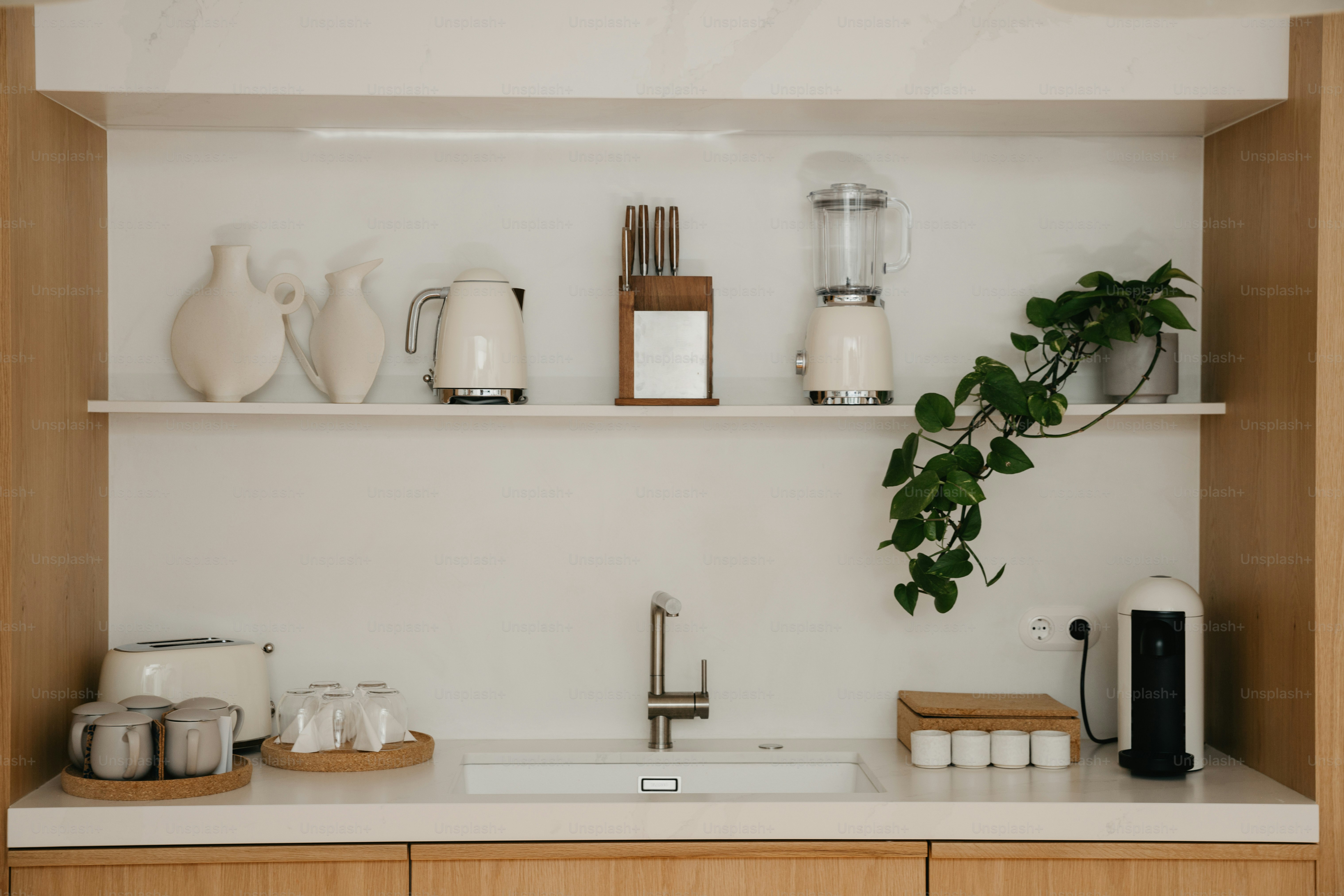 Kitchen counter with sink, appliances, and decor.