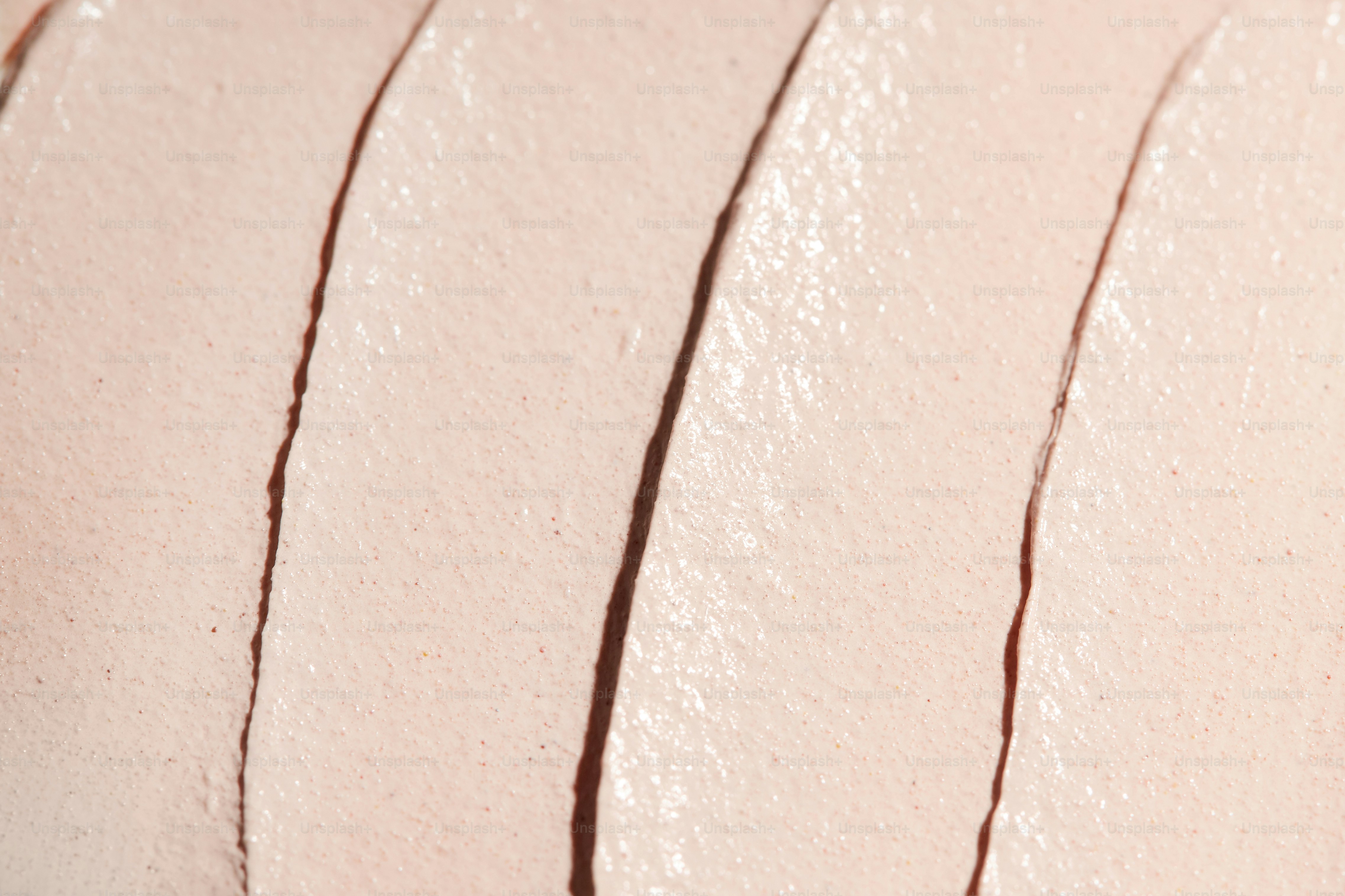 Close-up of pale pink cosmetic cream texture
