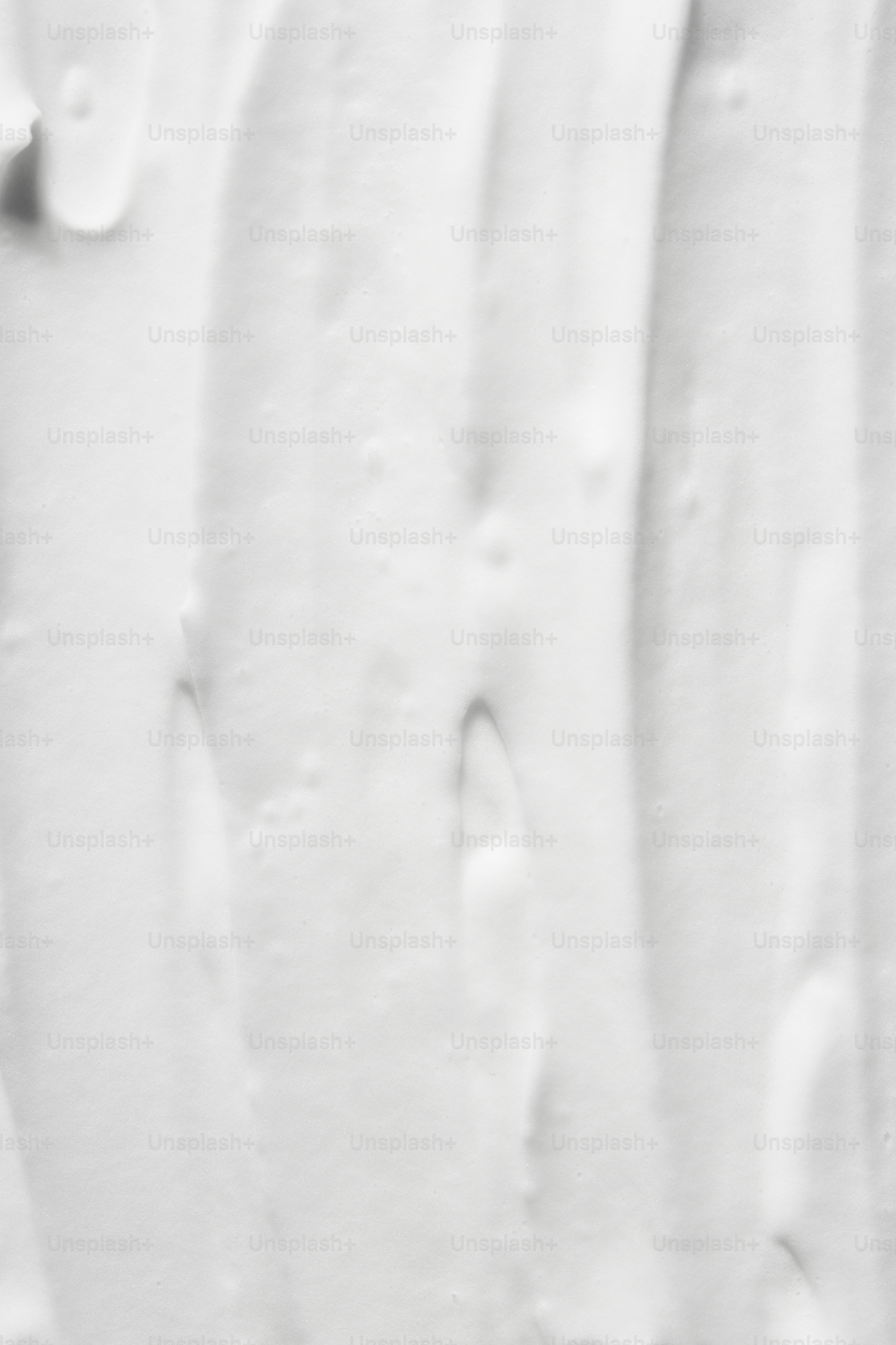 White textured background with vertical streaks