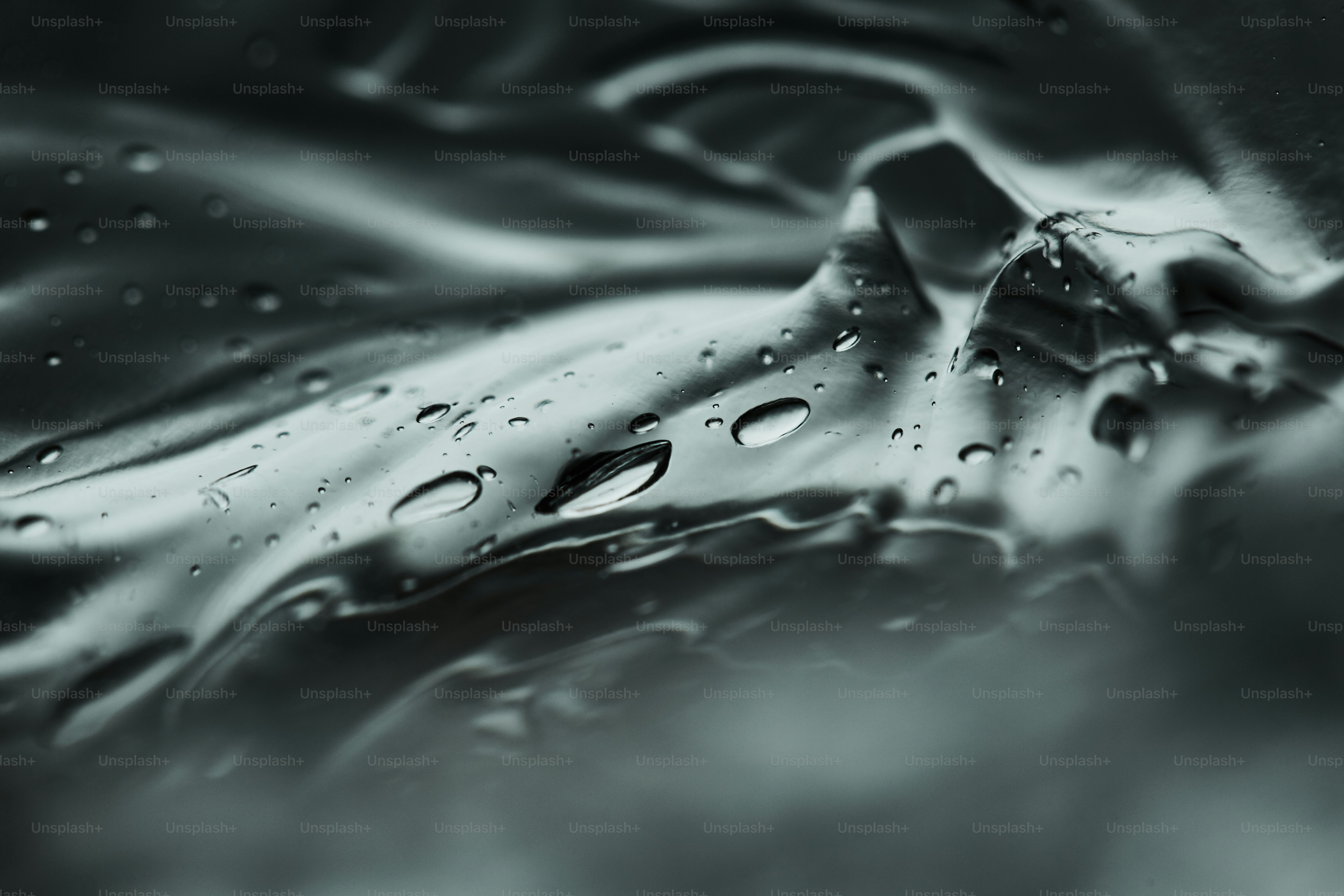 Close-up of water droplets on a metallic surface