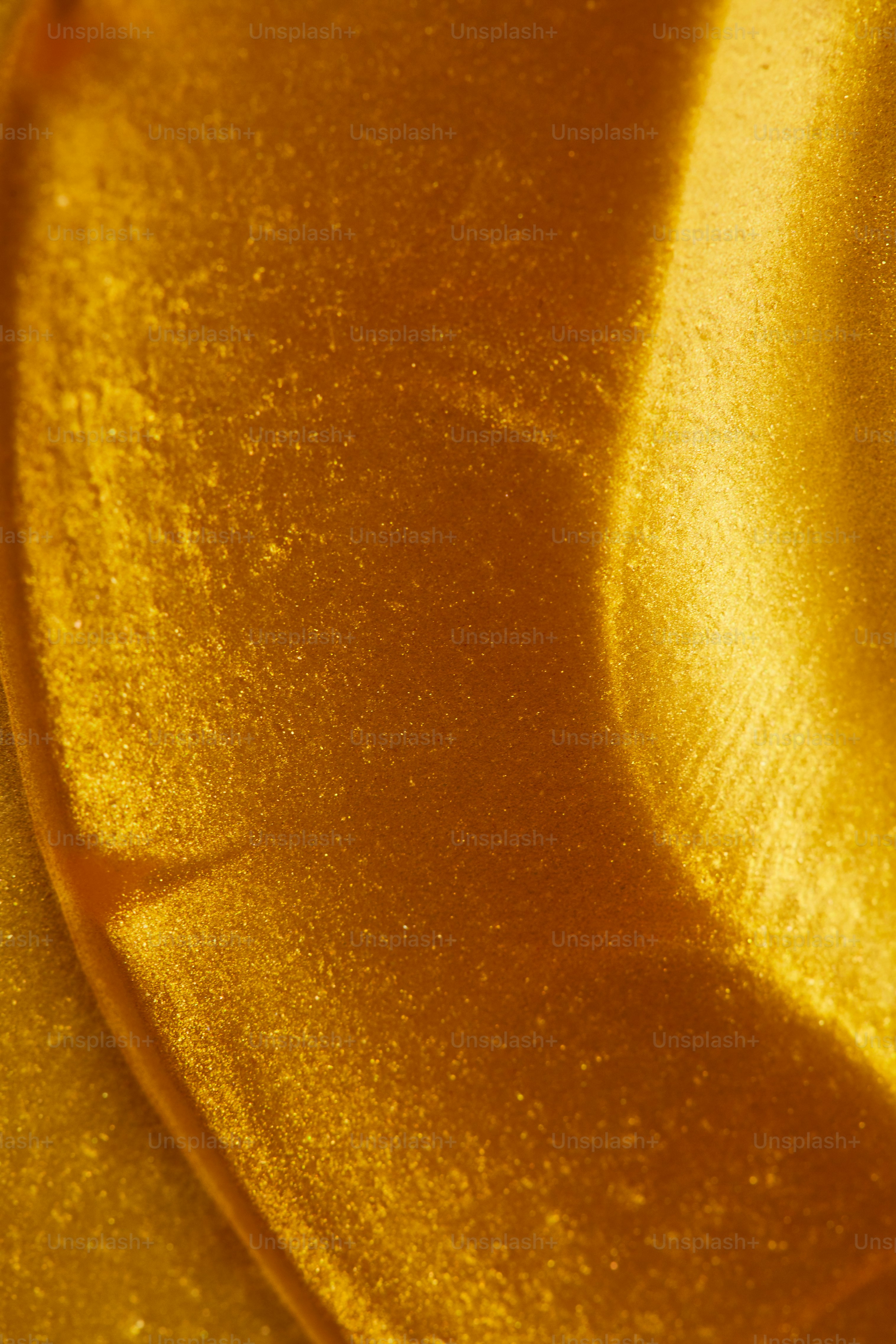 Textura dourada abstrata com padrões ondulantes