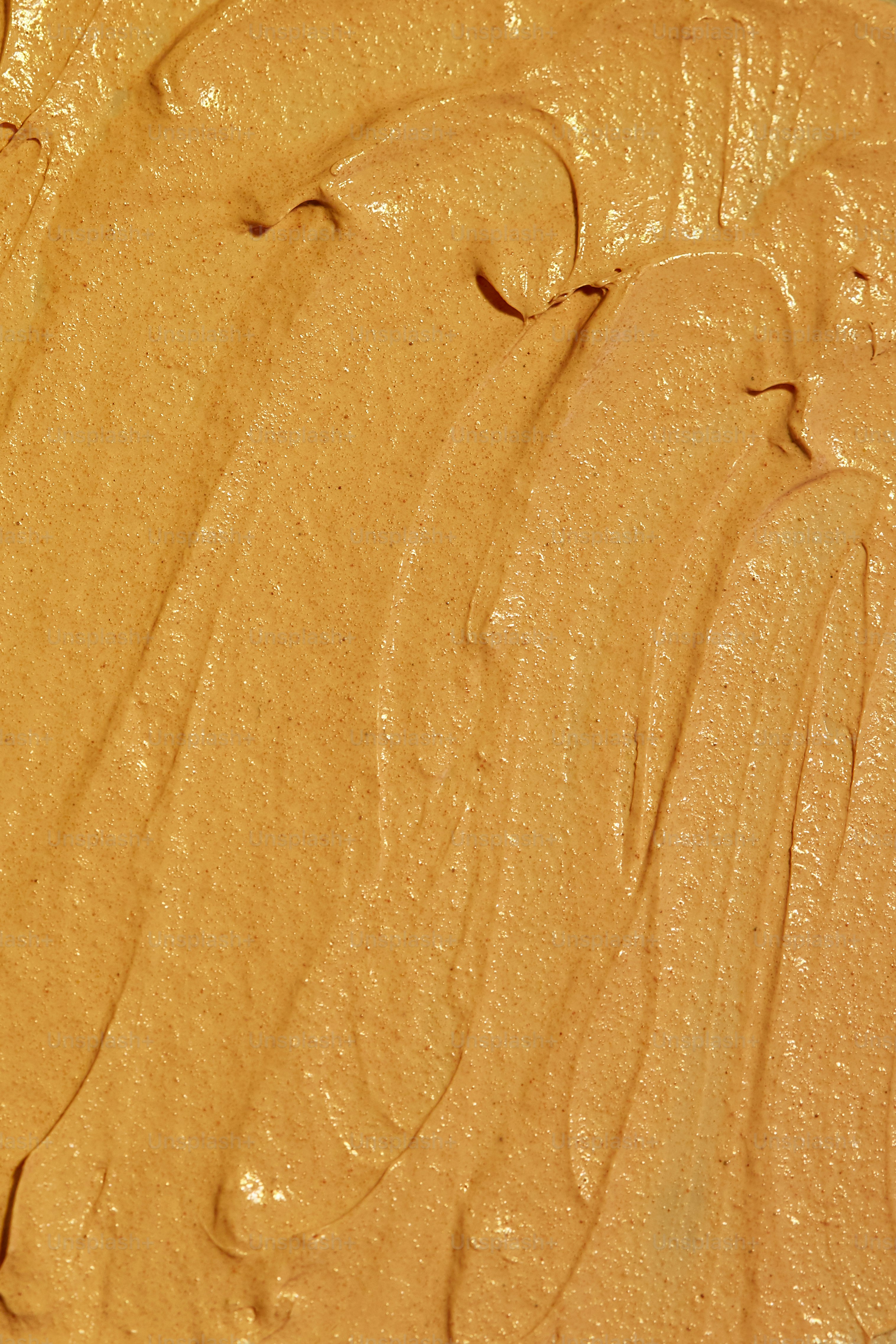 Close-up of a textured, light brown, creamy substance.