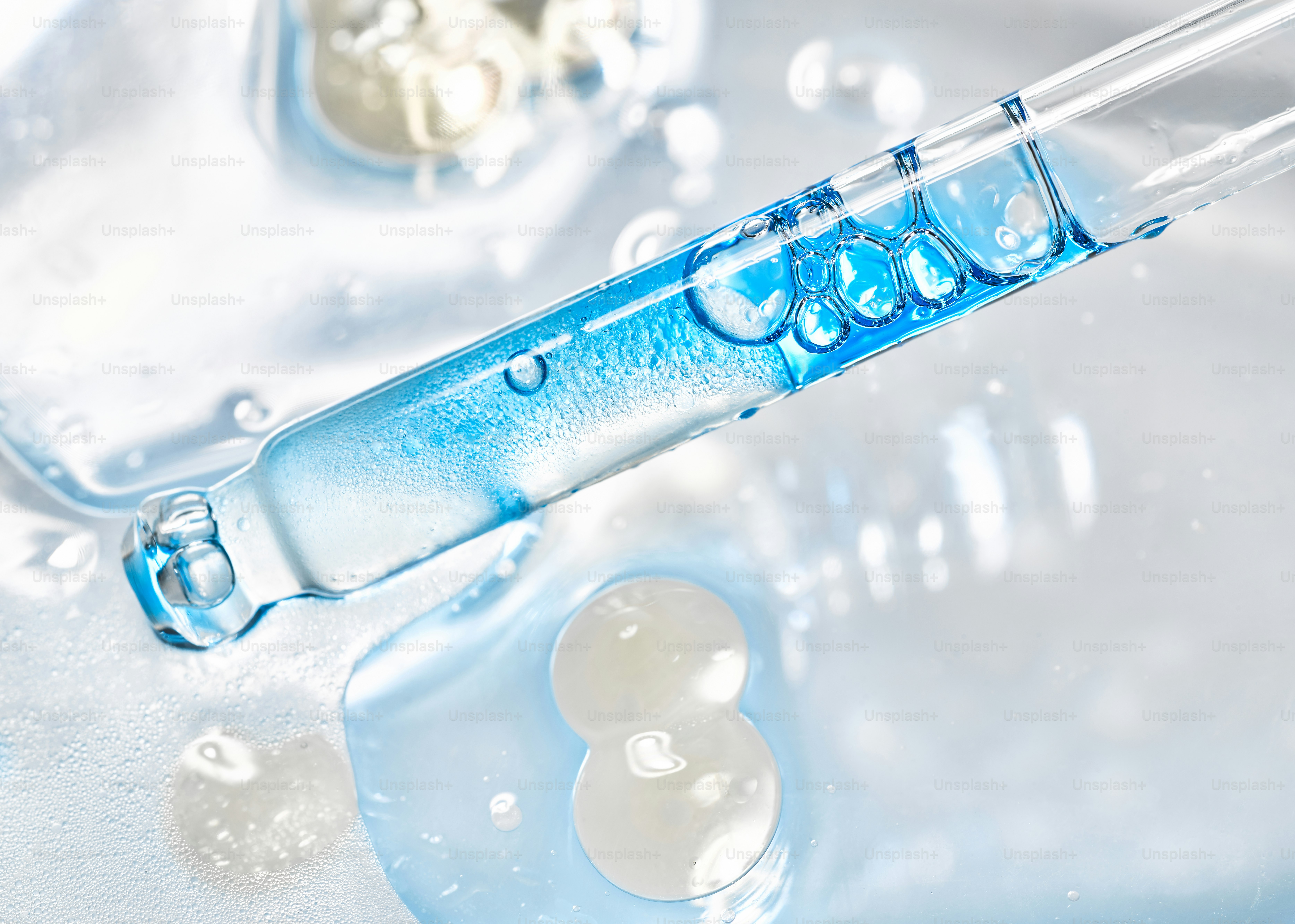 Blue liquid dripping from a laboratory dropper photo – Texture Image on ...