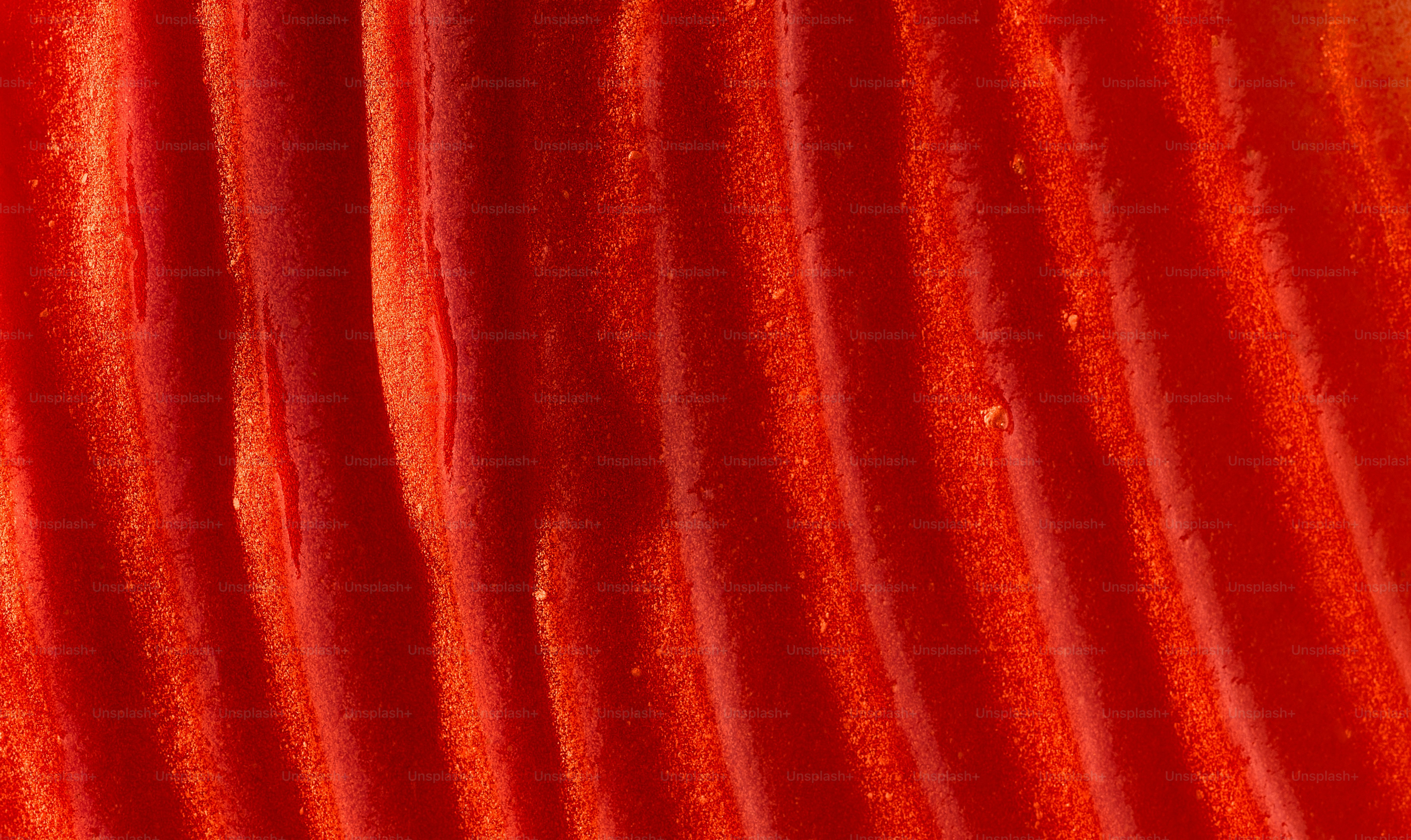 Close-up abstract texture of vibrant red stripes