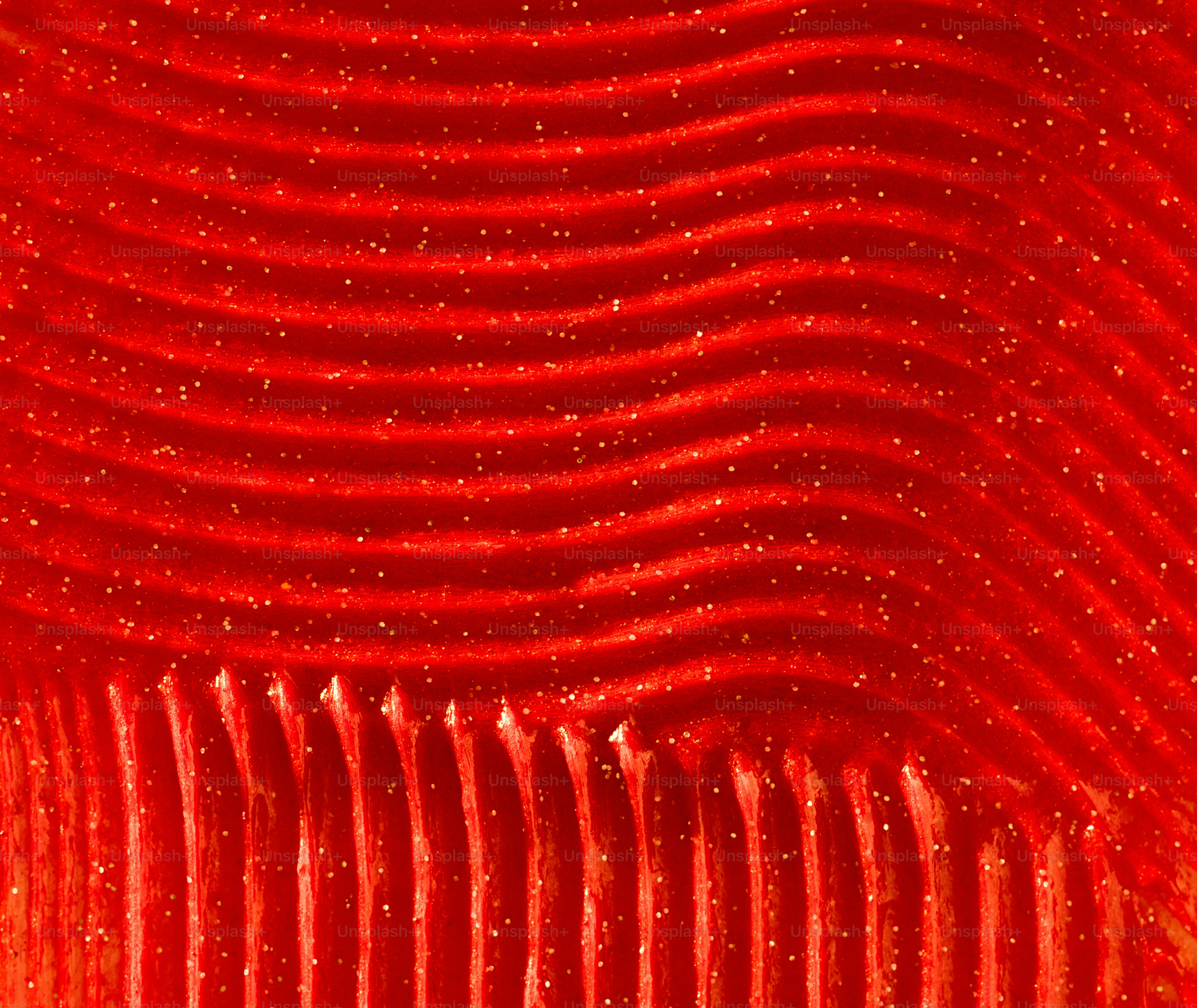 Texture abstraite ondulée rouge avec de petits points blancs
