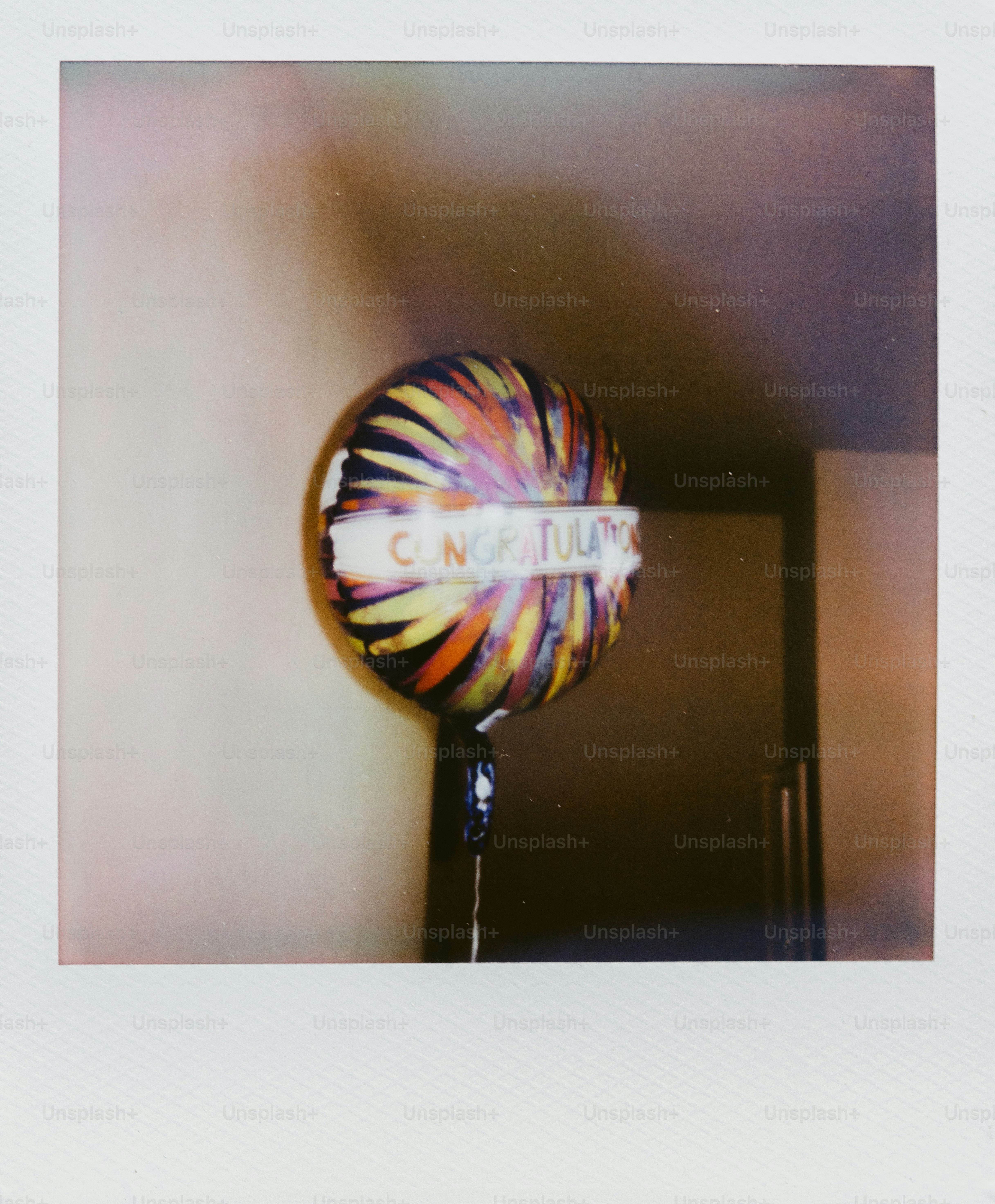 A colorful balloon with 'congratulations' written on it
