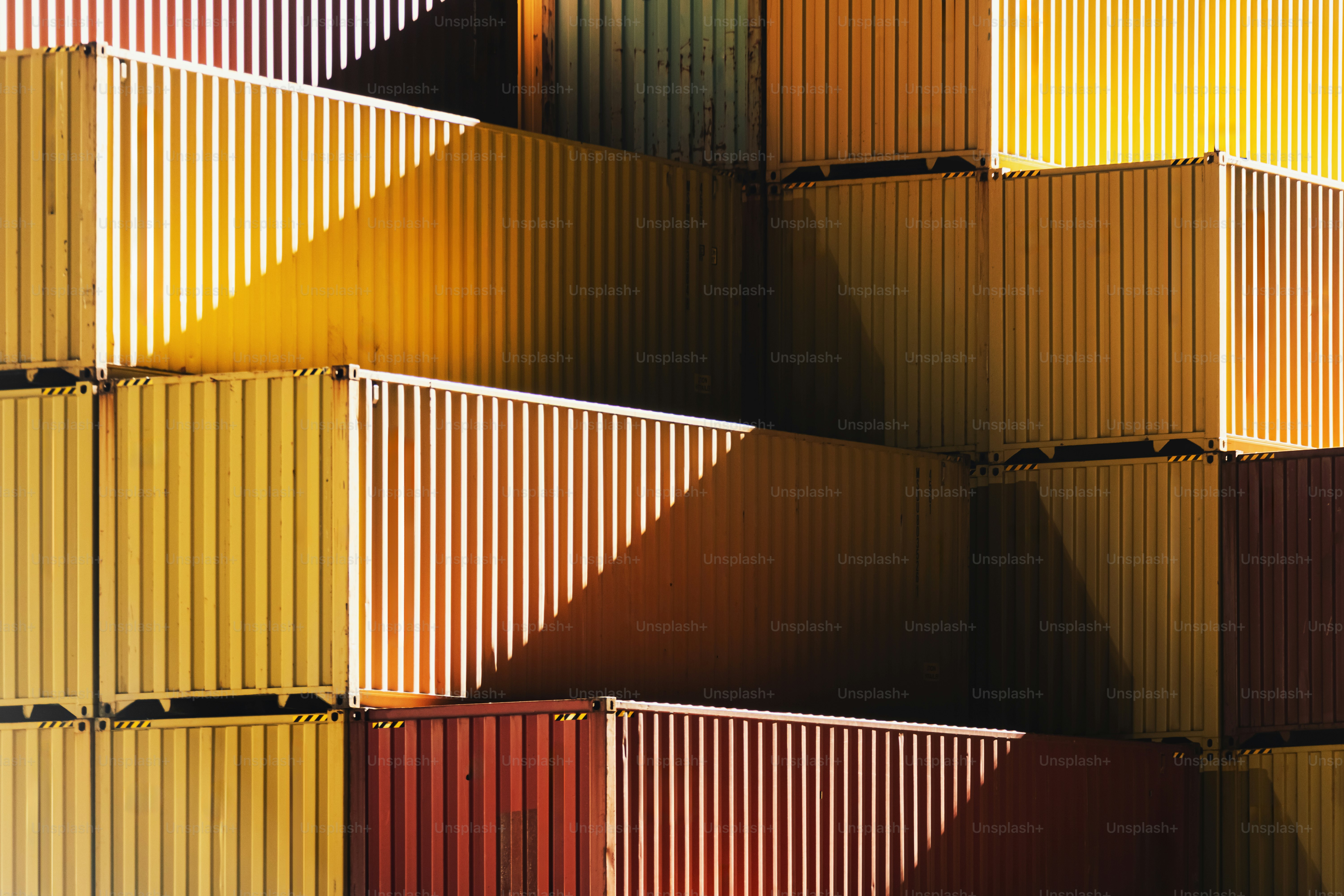 Containers are stacked at a cargo terminal dock. photo – Business Image ...