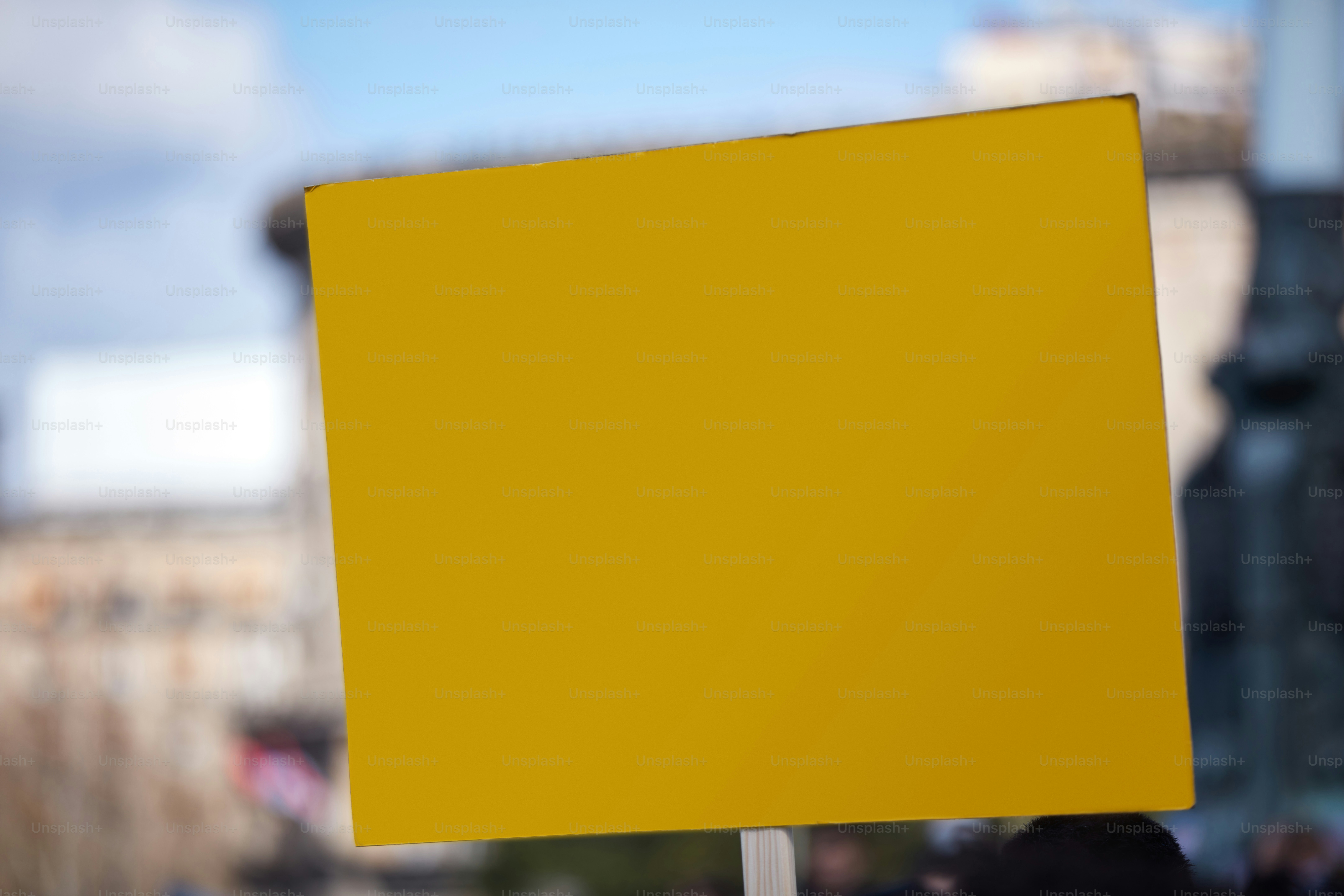Protesters holding placards and signs on the streets.