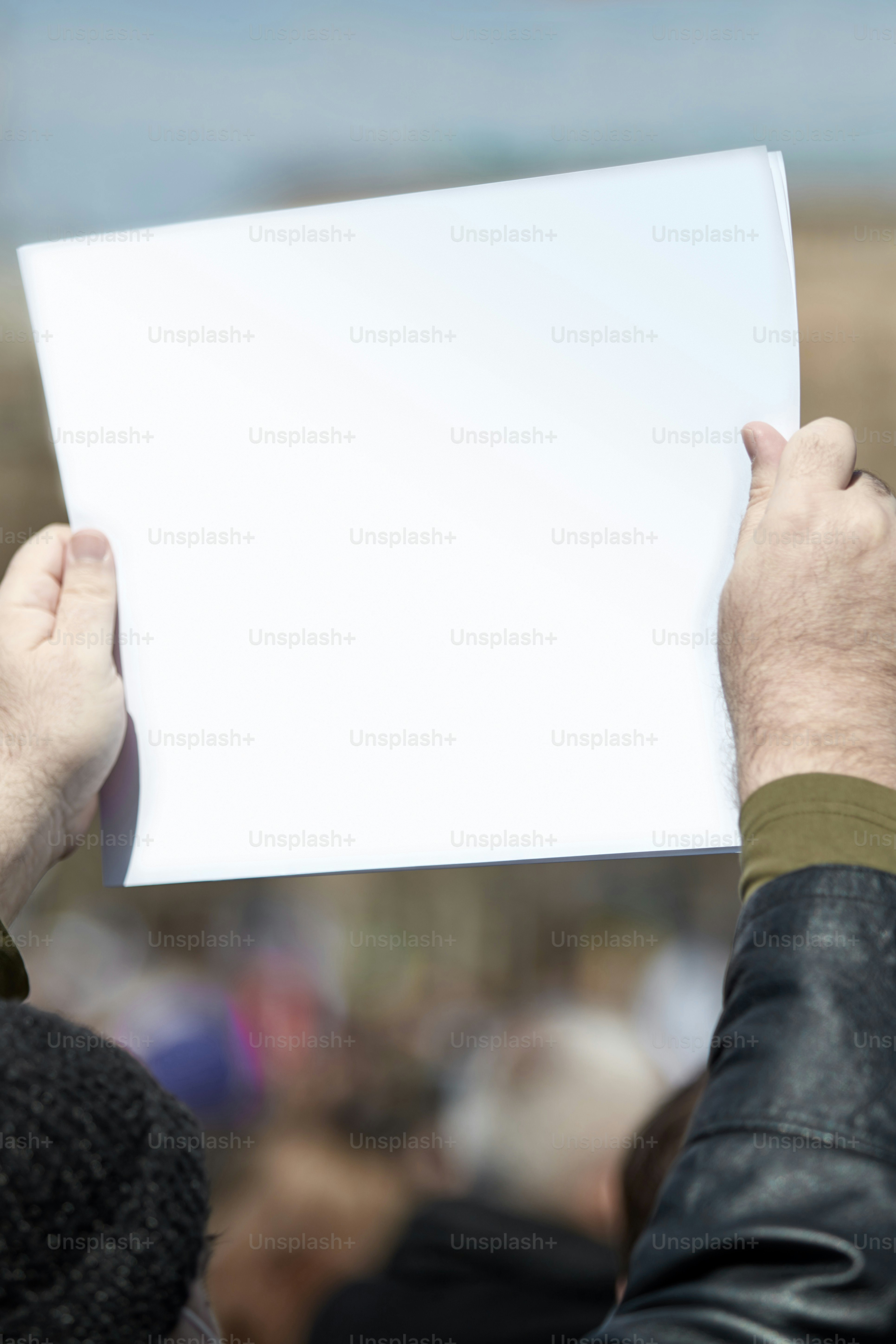 Protesters holding placards and signs on the streets.