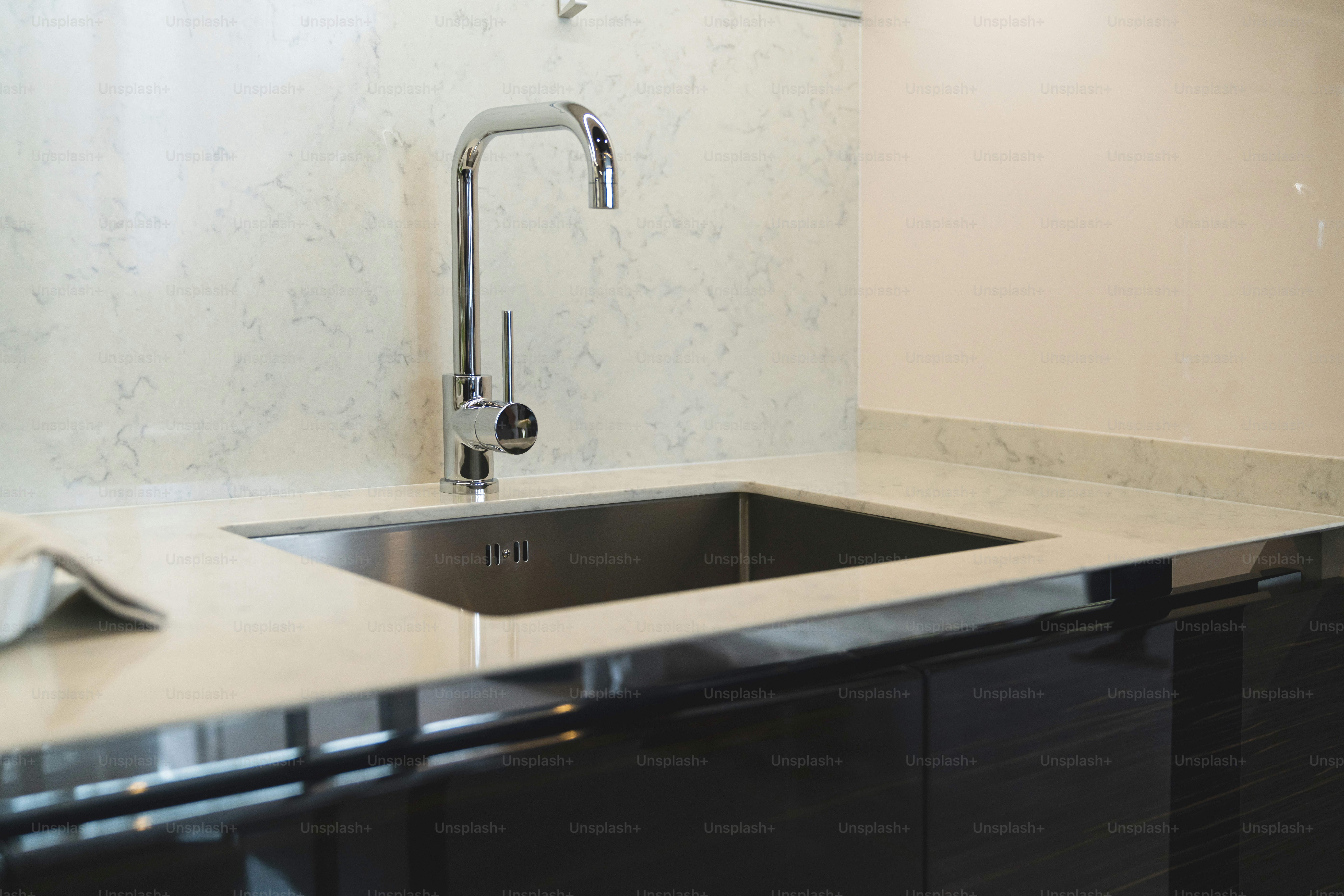 close up sink or lavatory with white marble counter interior background