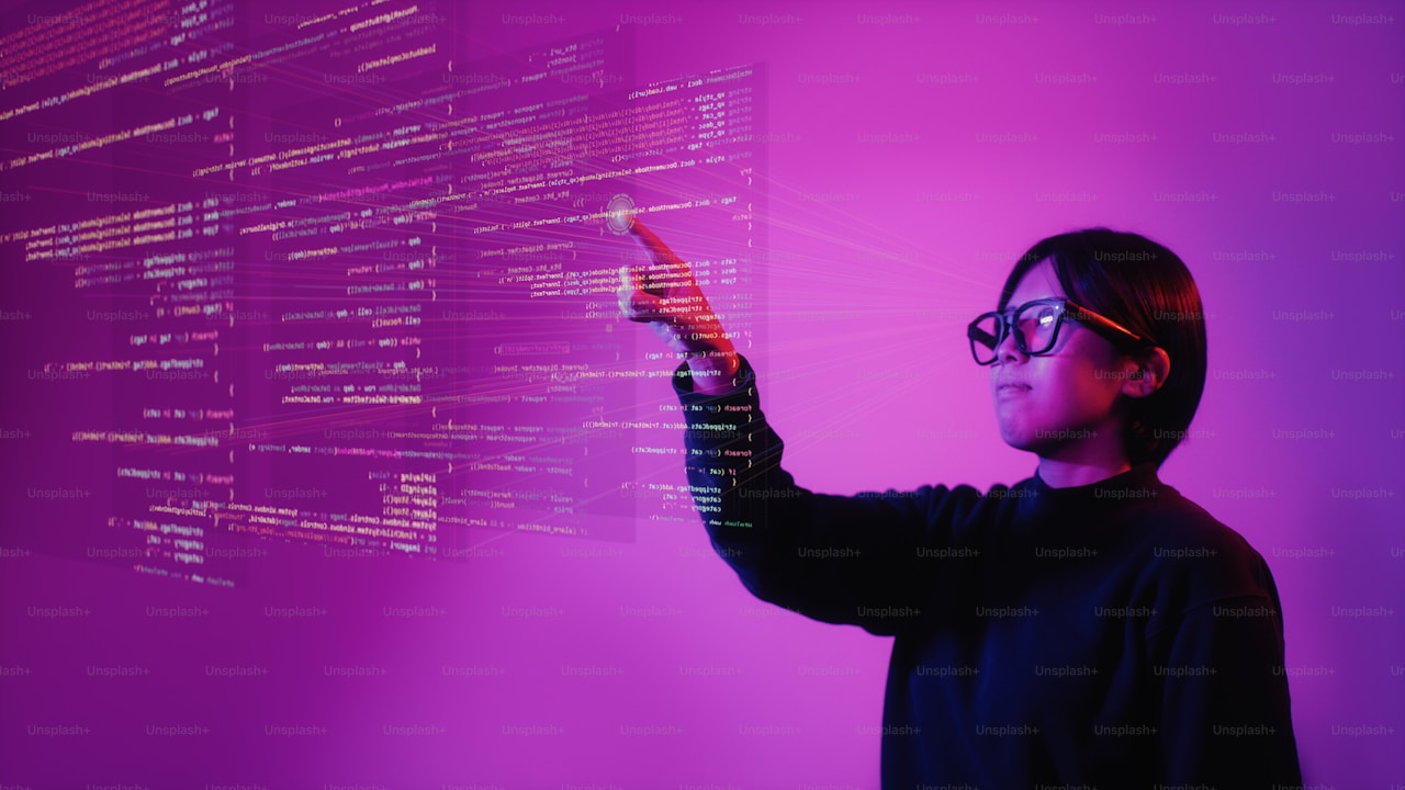 A person wearing smart glasses reaches toward floating code panels in a magenta neon space — Android XR's agentic developer demo