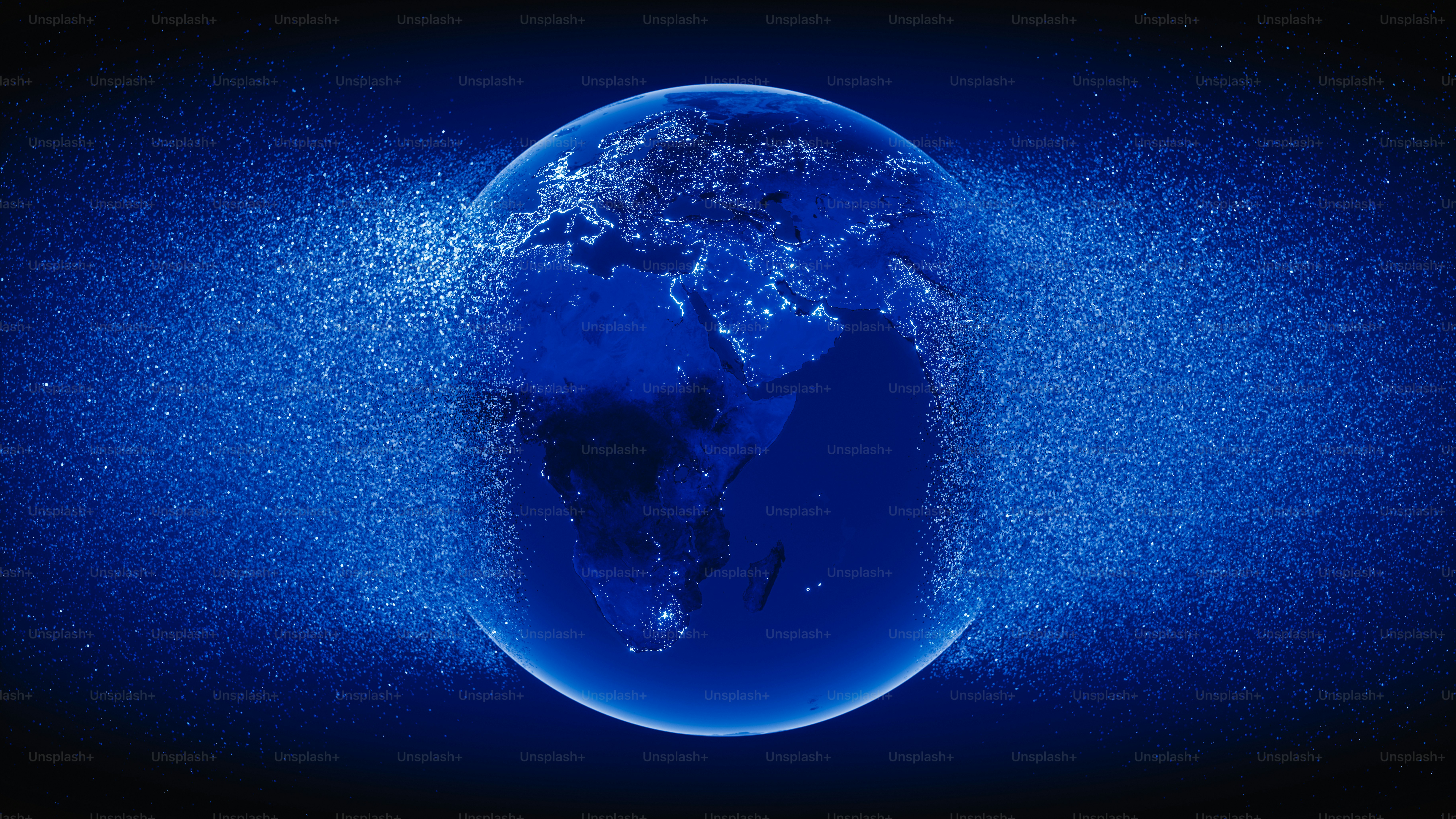 Abstract blue Globe exploding with particles.(World Map Courtesy of NASA: https://visibleearth.nasa.gov/view.php?id=55167)