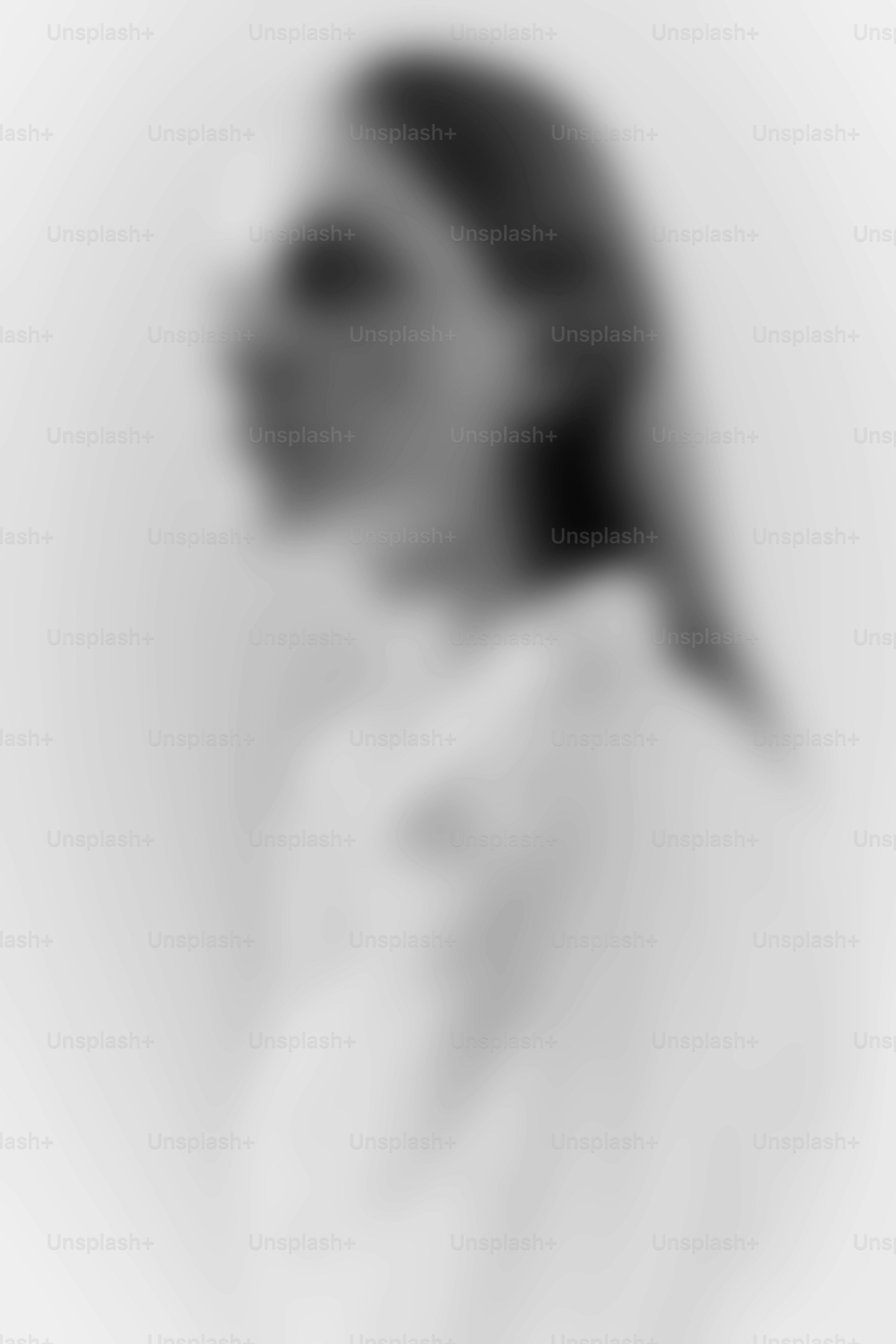 Blurred profile of a person in a white shirt