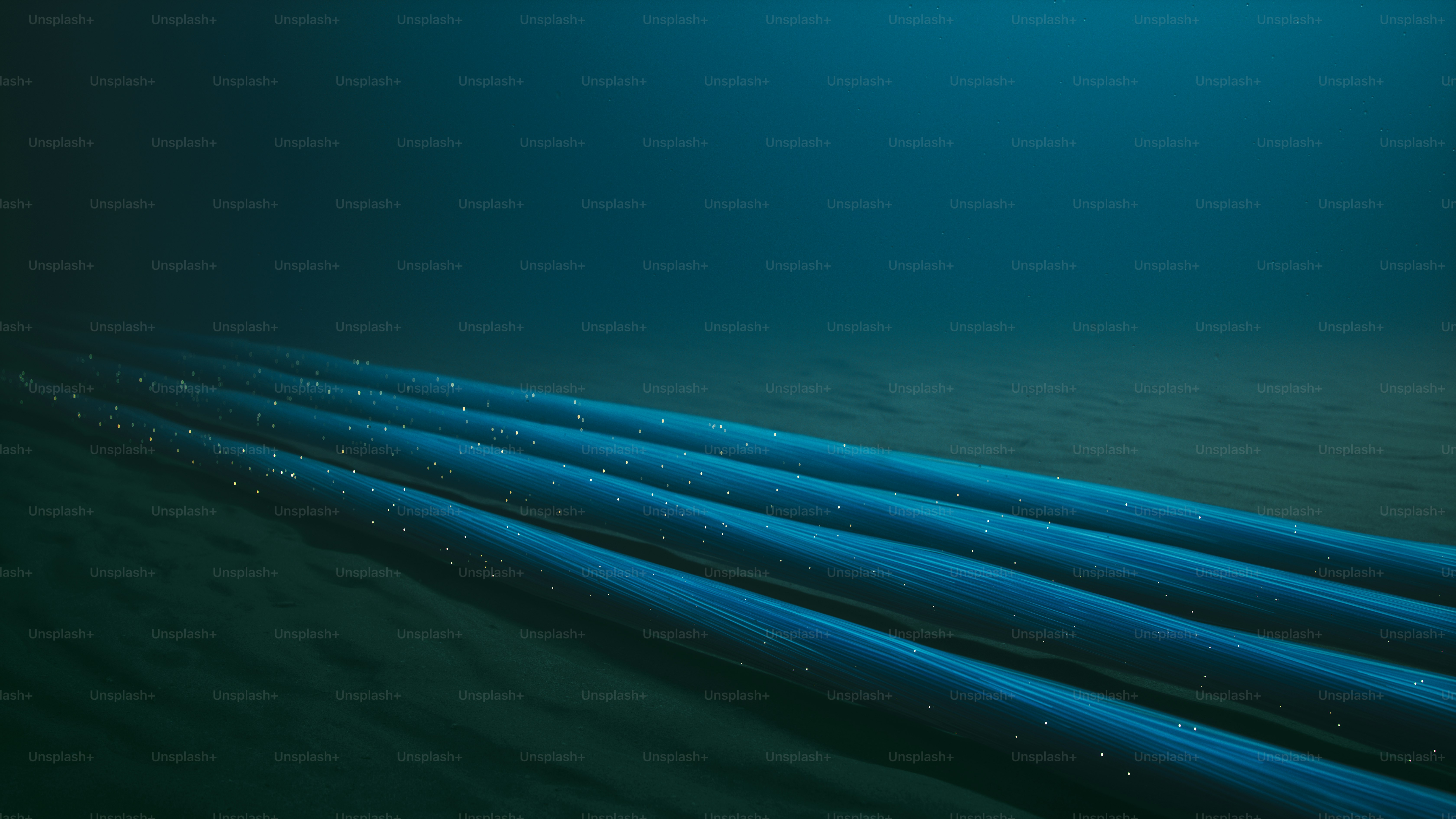 A detailed visualization of fiber optic cables lying on the seabed, with glowing data streams running through them.