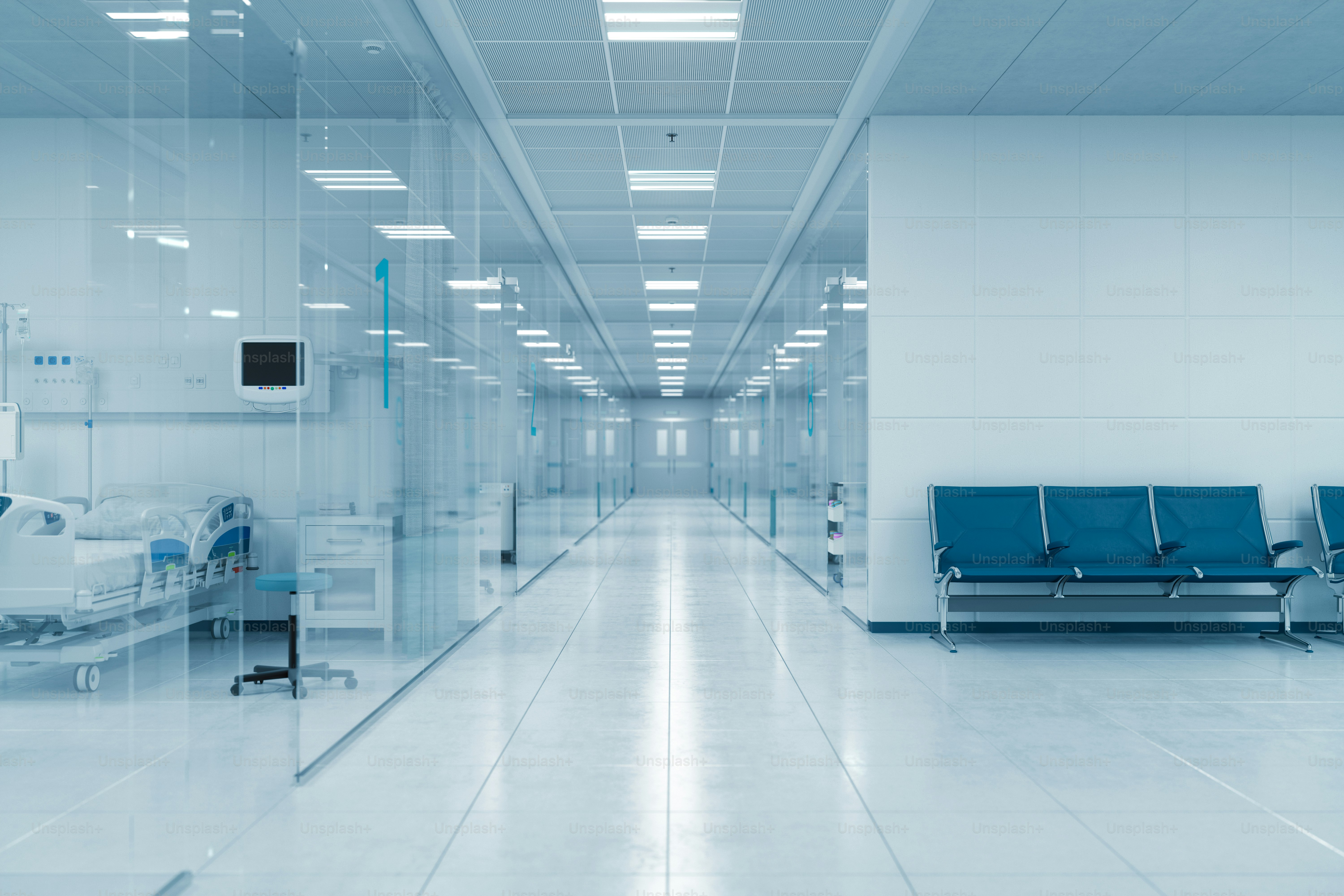 3D render of a modern hospital corridor featuring glass-walled rooms on the left. On the right side, there's a bench against a blank wall with copy-space, perfect for adding text or graphics.