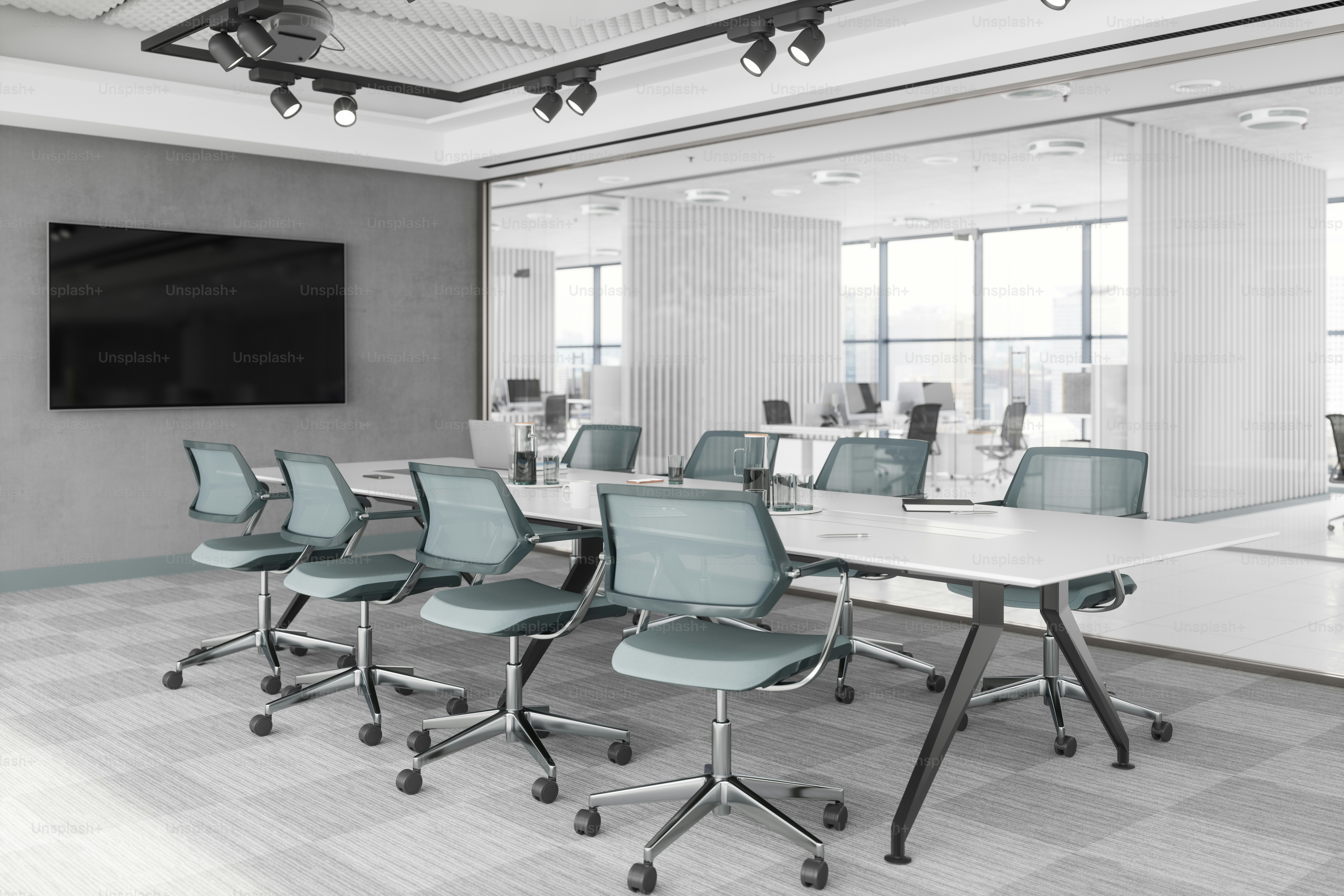 An empty meeting room and conference table in a modern company.