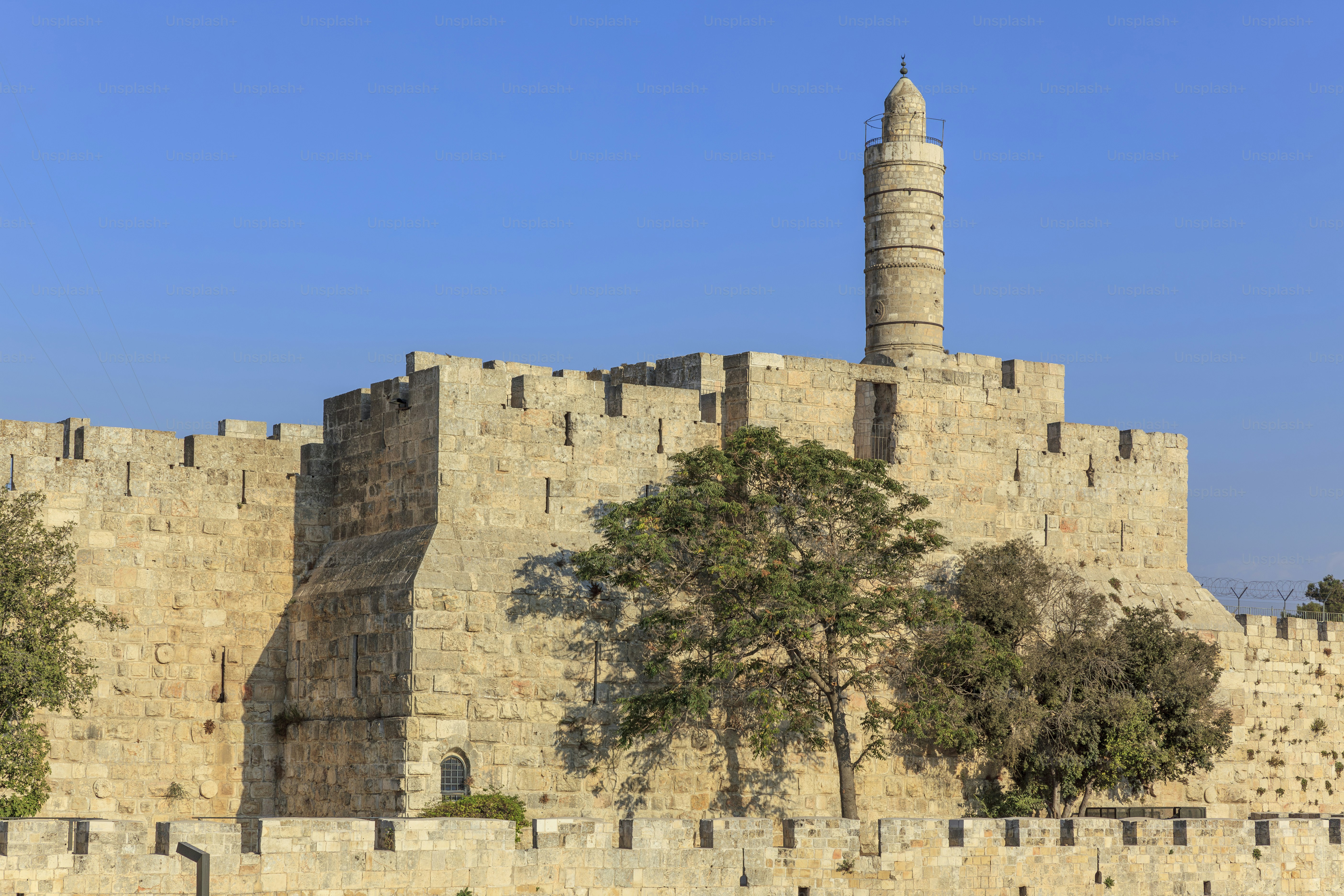 The Tower of David and the surrounding city walls in Jerusalem, Israel, form a historic citadel at the entrance to the Old City.