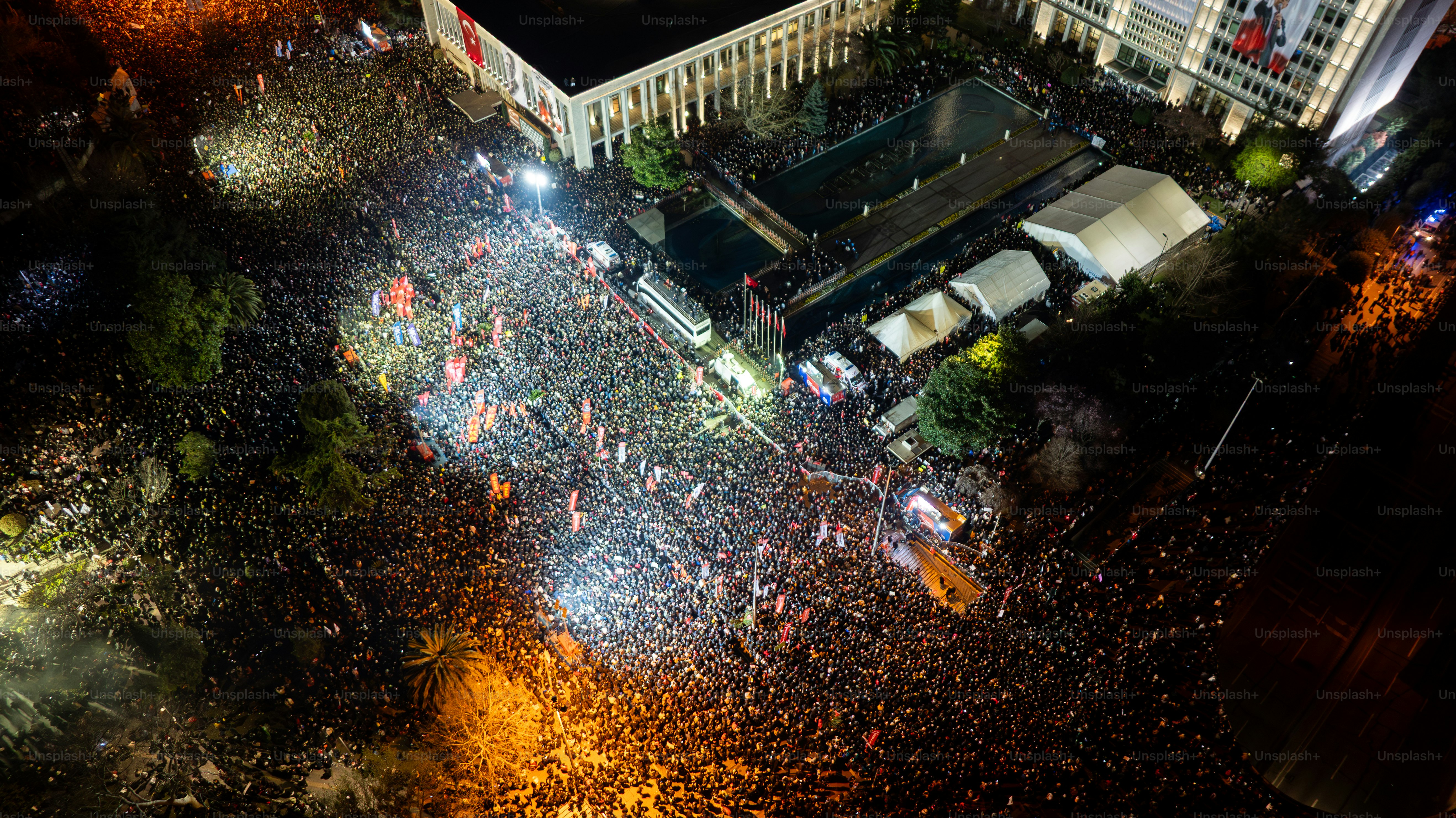 Thousands of people protest against the arrest of Ekram Imamoğlu in front of the Istanbul Metropolitan Municipality in Sarachan on March 20, 2025 in ıstanbul, Türkiye. Drone.