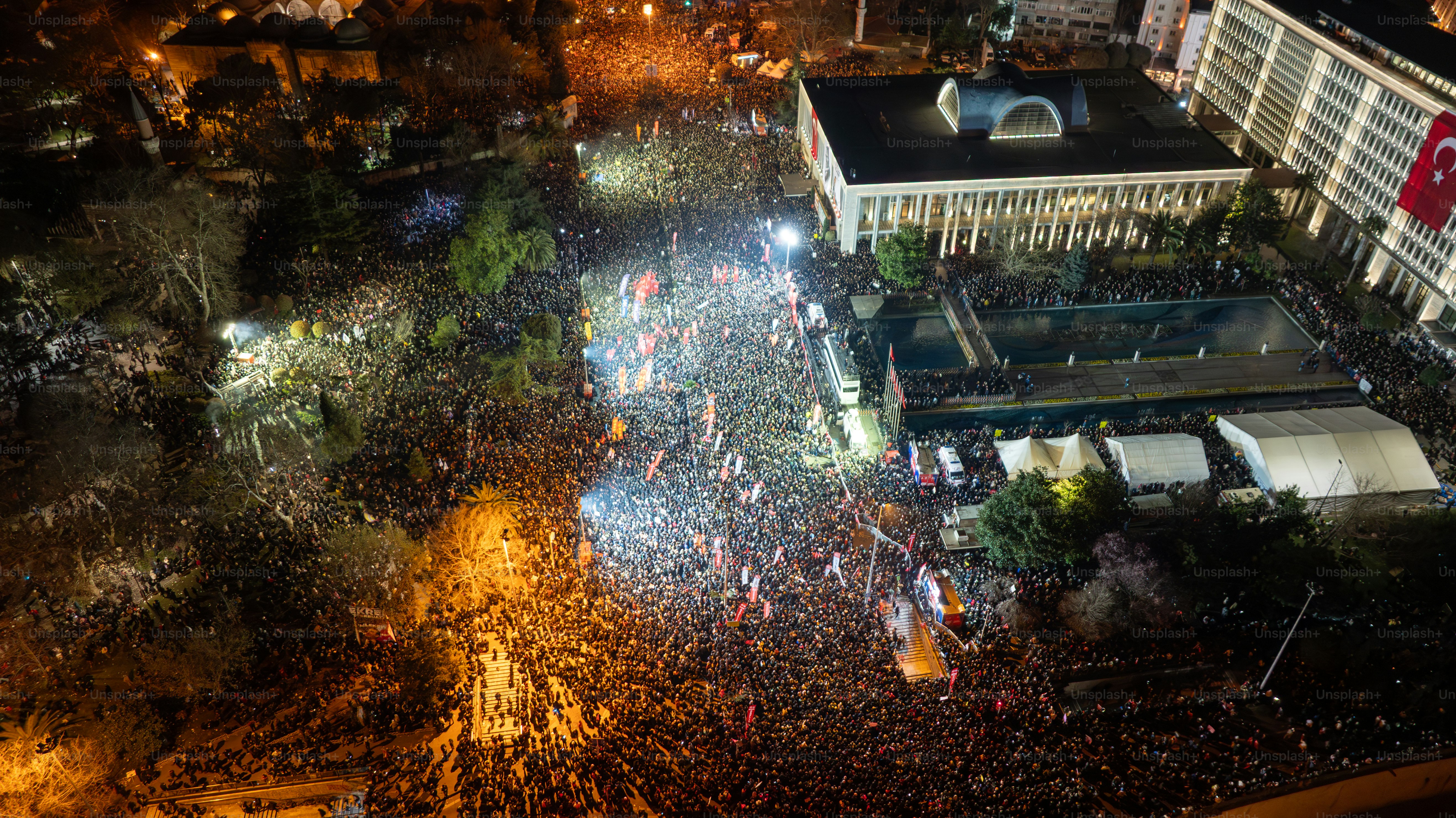 Thousands of people protest against the arrest of Ekram Imamoğlu in front of the Istanbul Metropolitan Municipality in Sarachan on March 20, 2025 in ıstanbul, Türkiye. Drone.