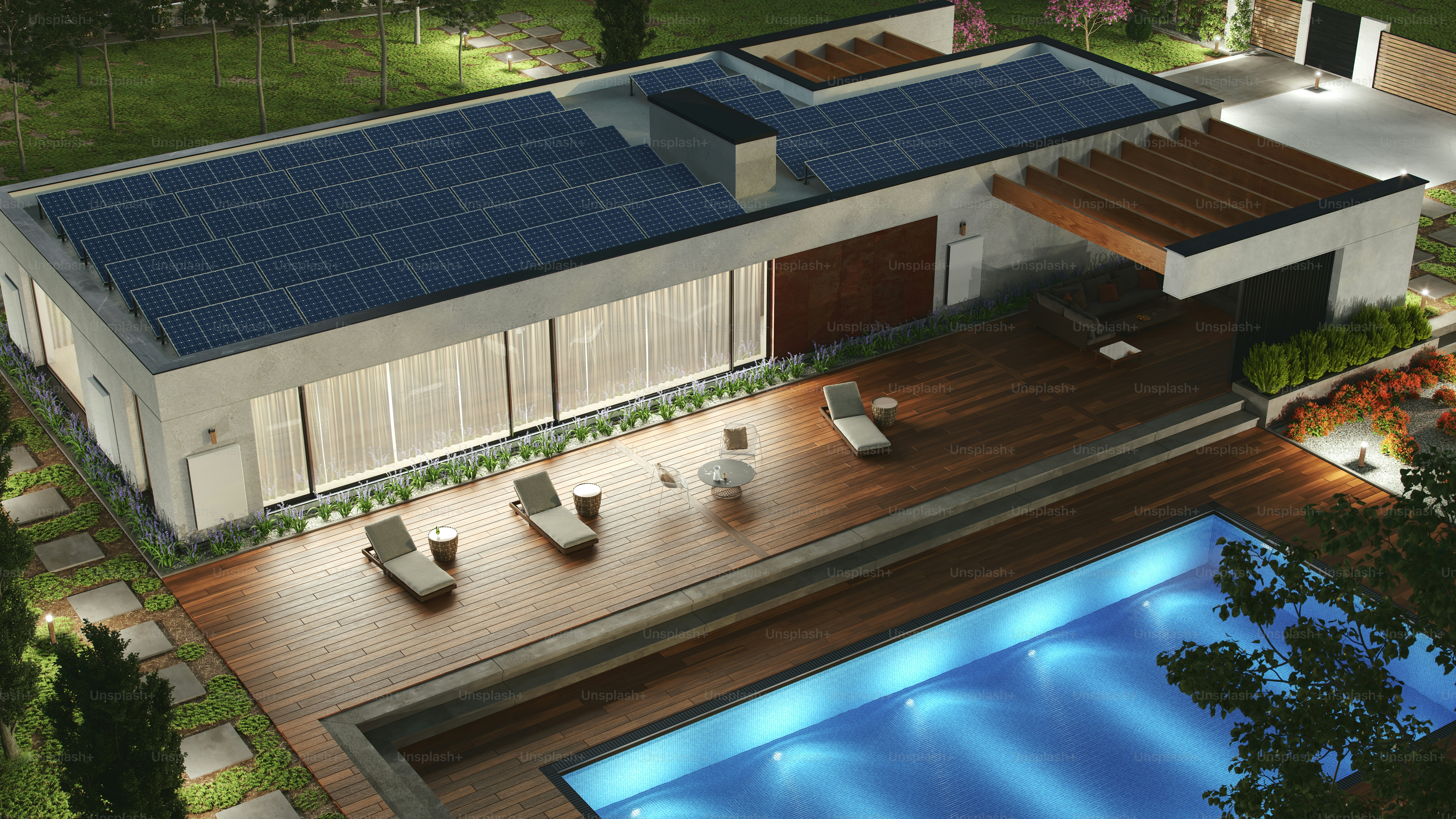 Contemporary house equipped with solar panels and an energy storage wall battery during dusk.