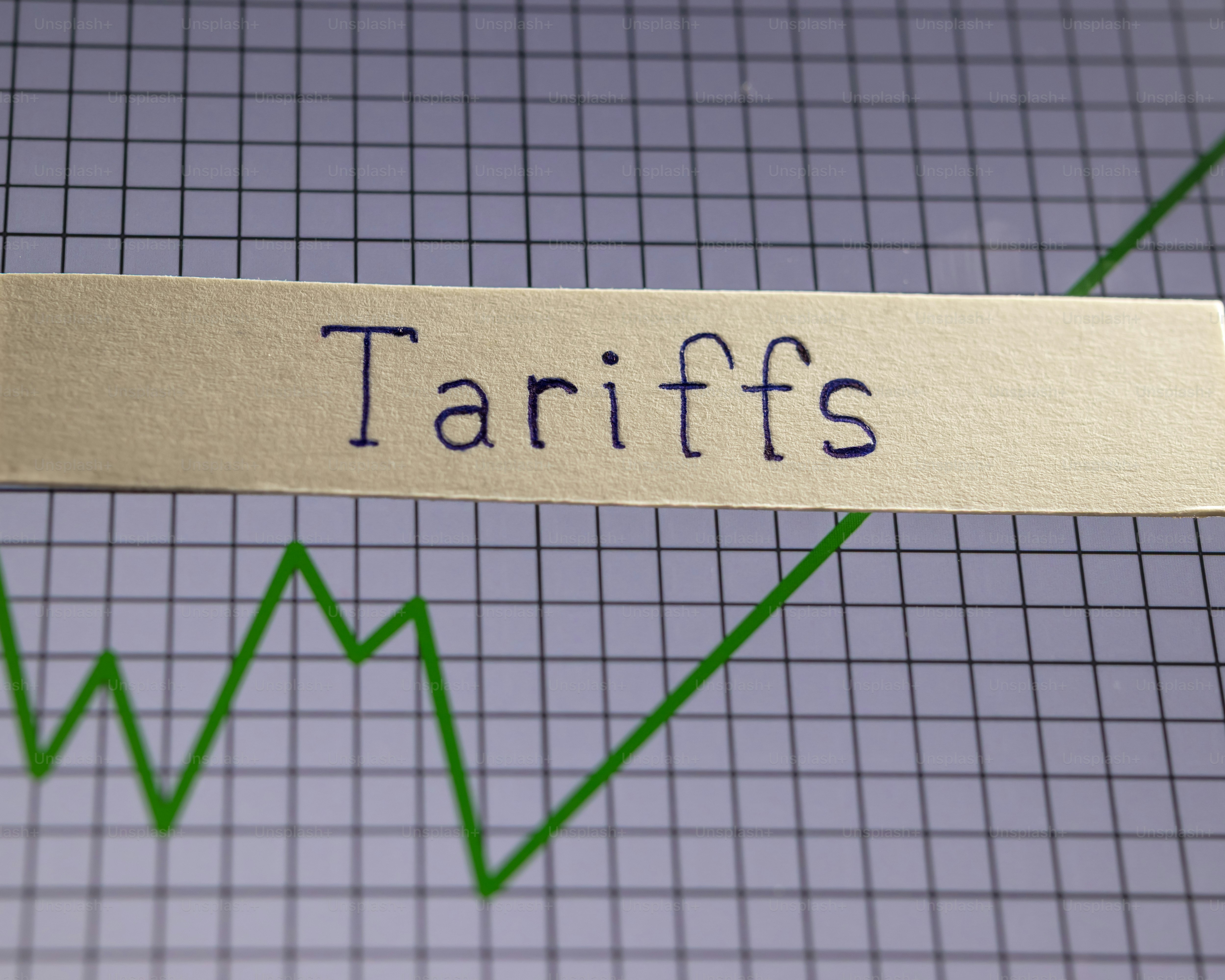 Tariffs word and economic graph
