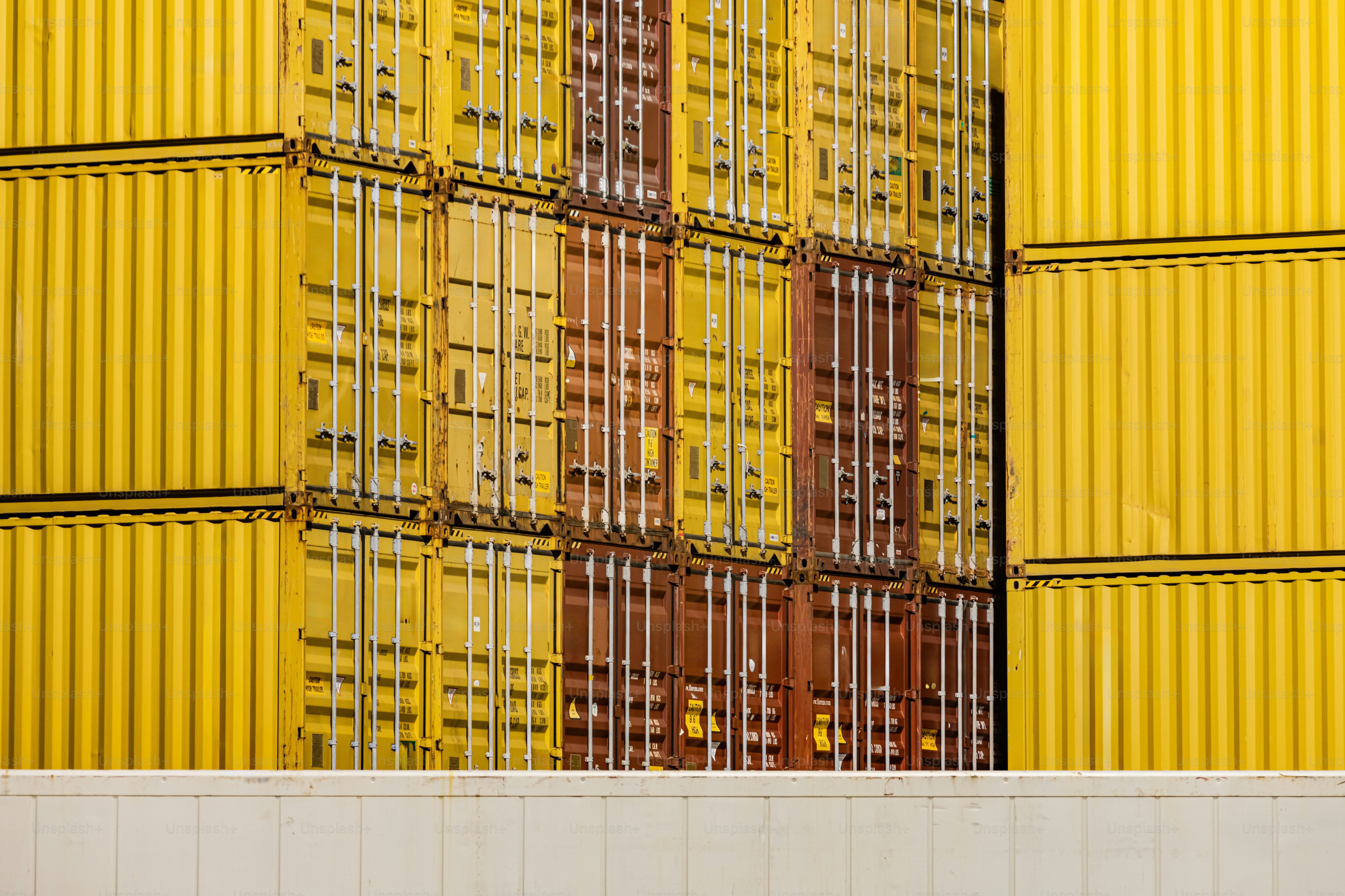 Containers are stacked at a cargo terminal dock. photo – Business Image ...