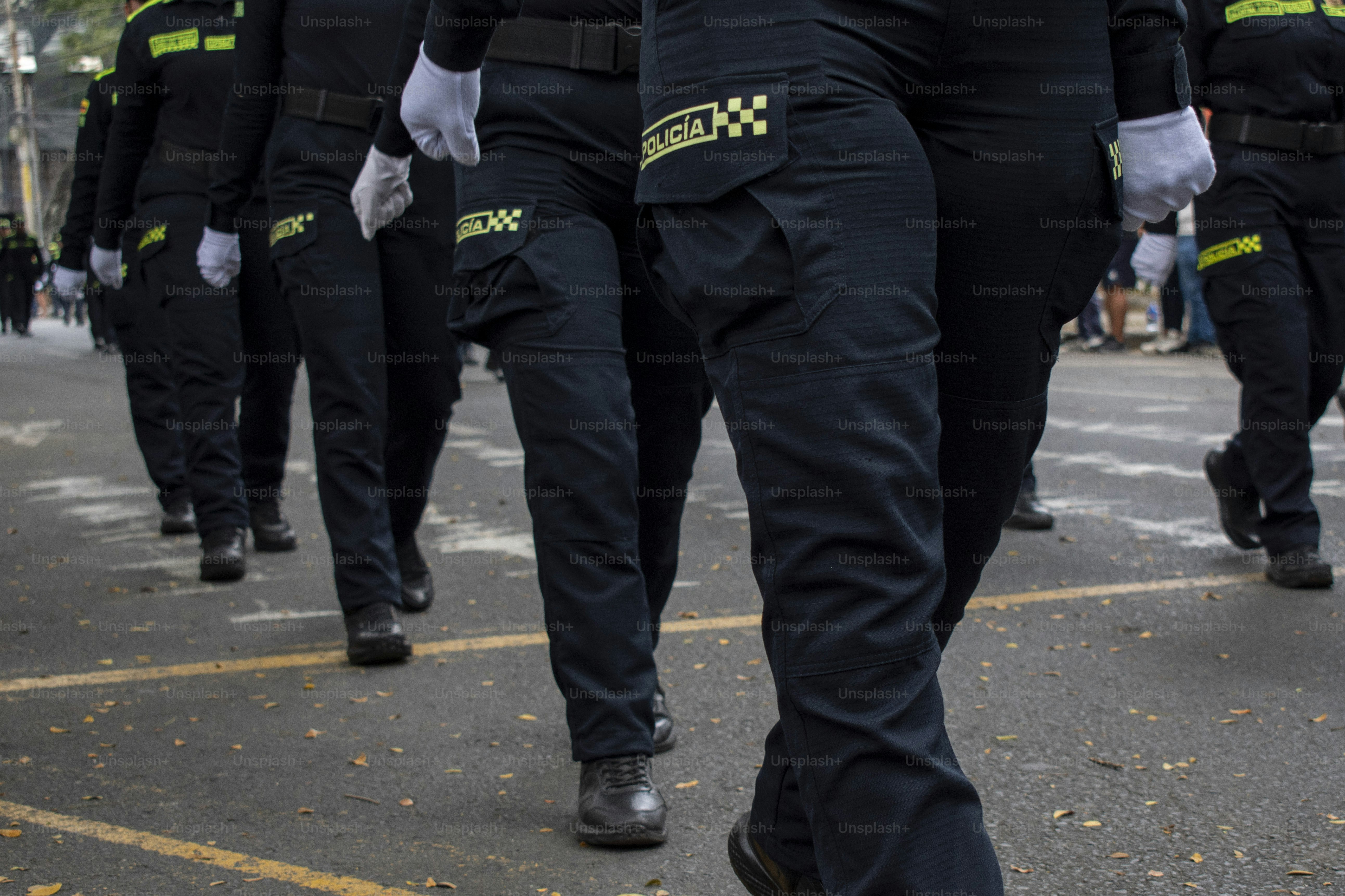 Colombian police officers marching in formation, Law enforcement parade with uniforms, Police discipline and order display. High quality photo