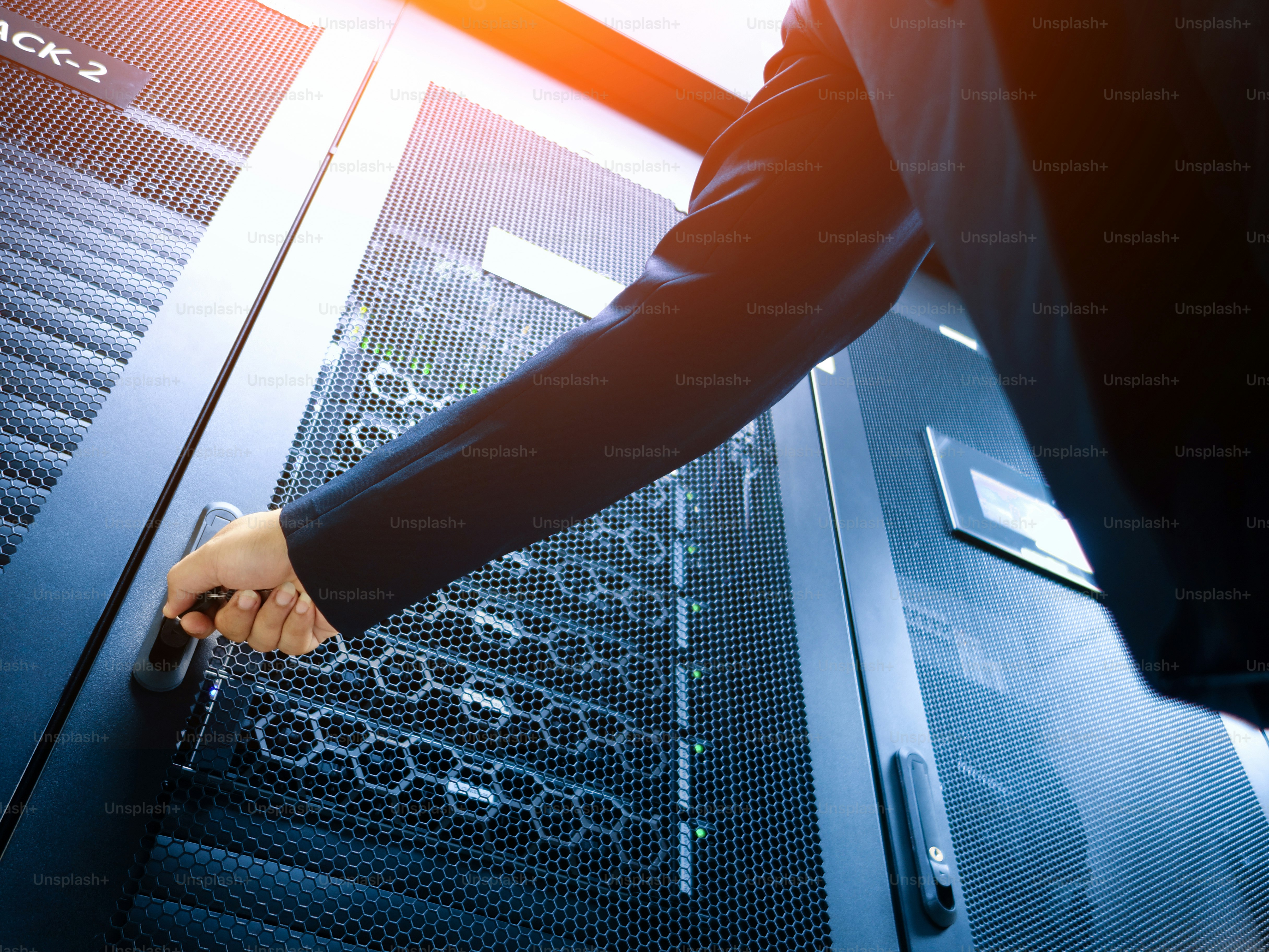 Security operators using AI security monitoring software inside a modern office building command center