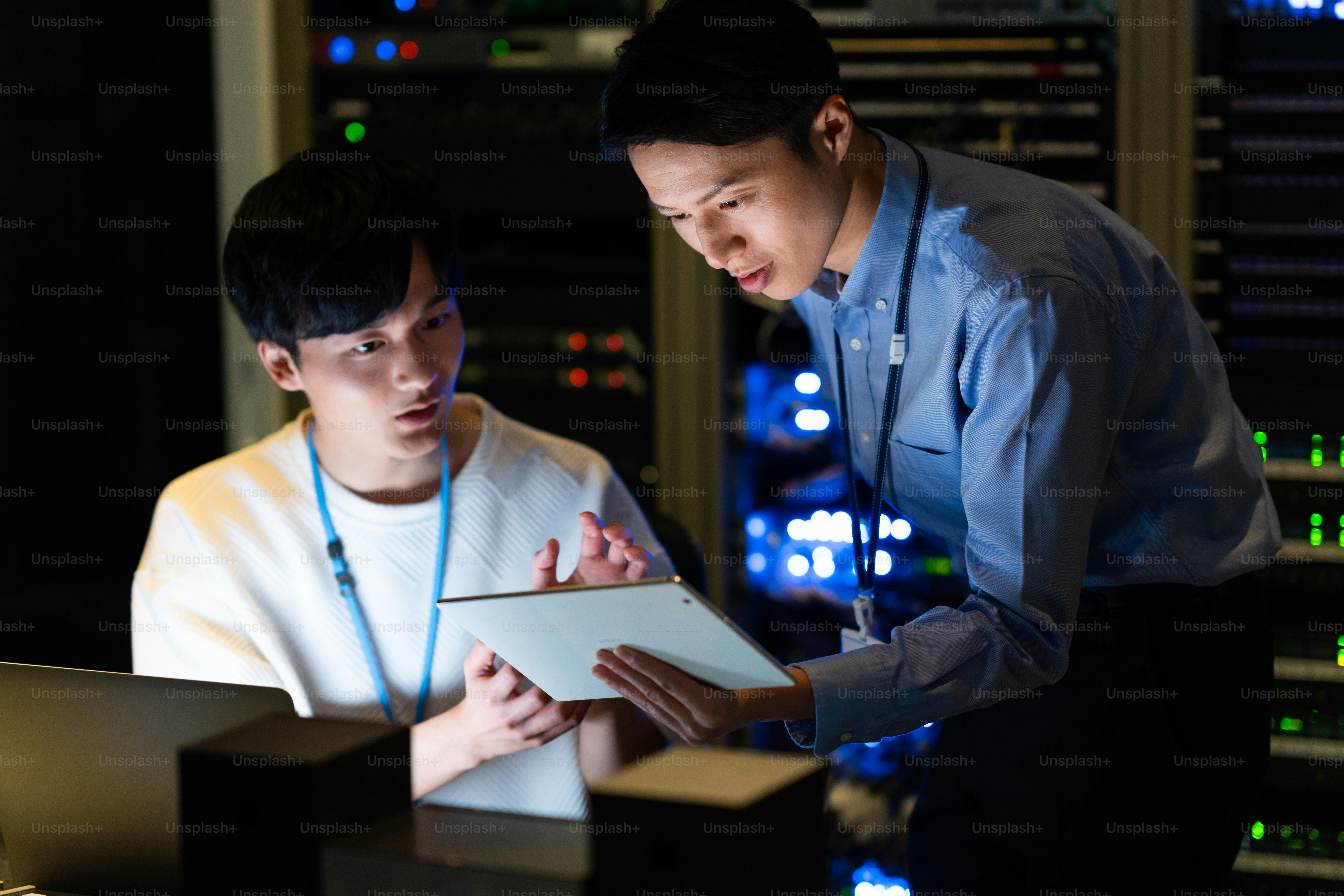 Japanese male engineer working in a server room photo – Technology ...