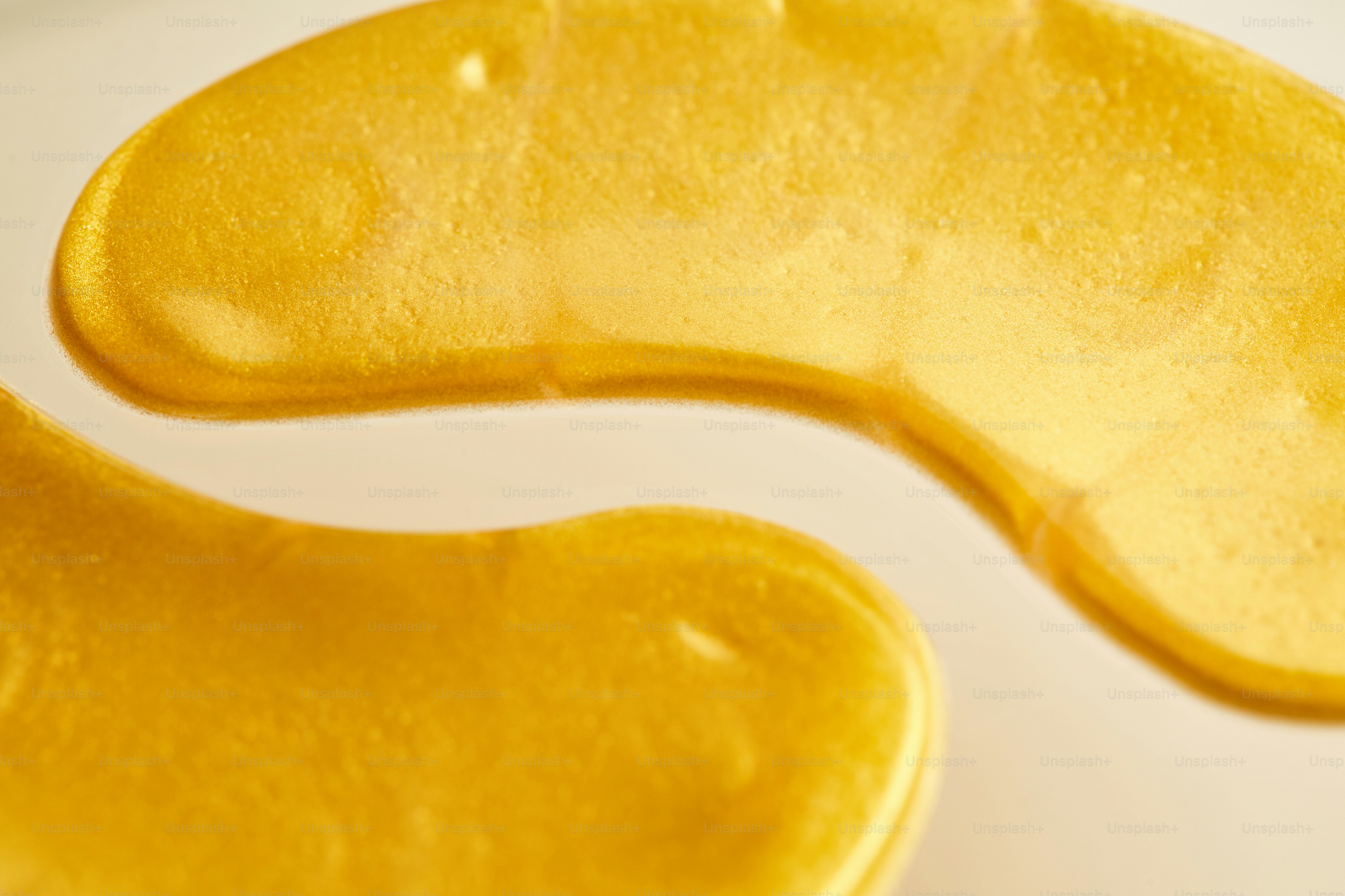 Two golden eye patches with shimmering texture