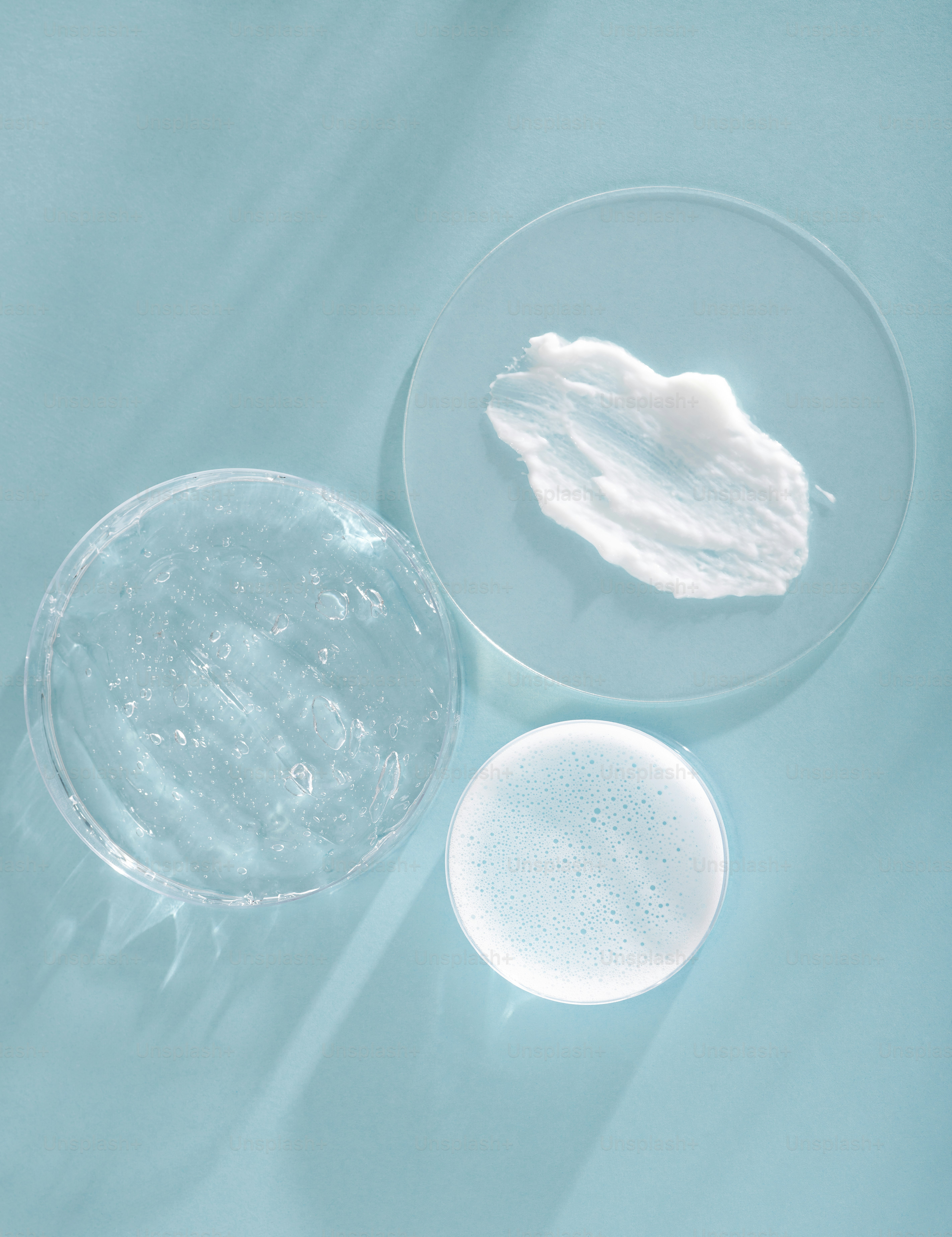 Three cosmetic textures on blue background